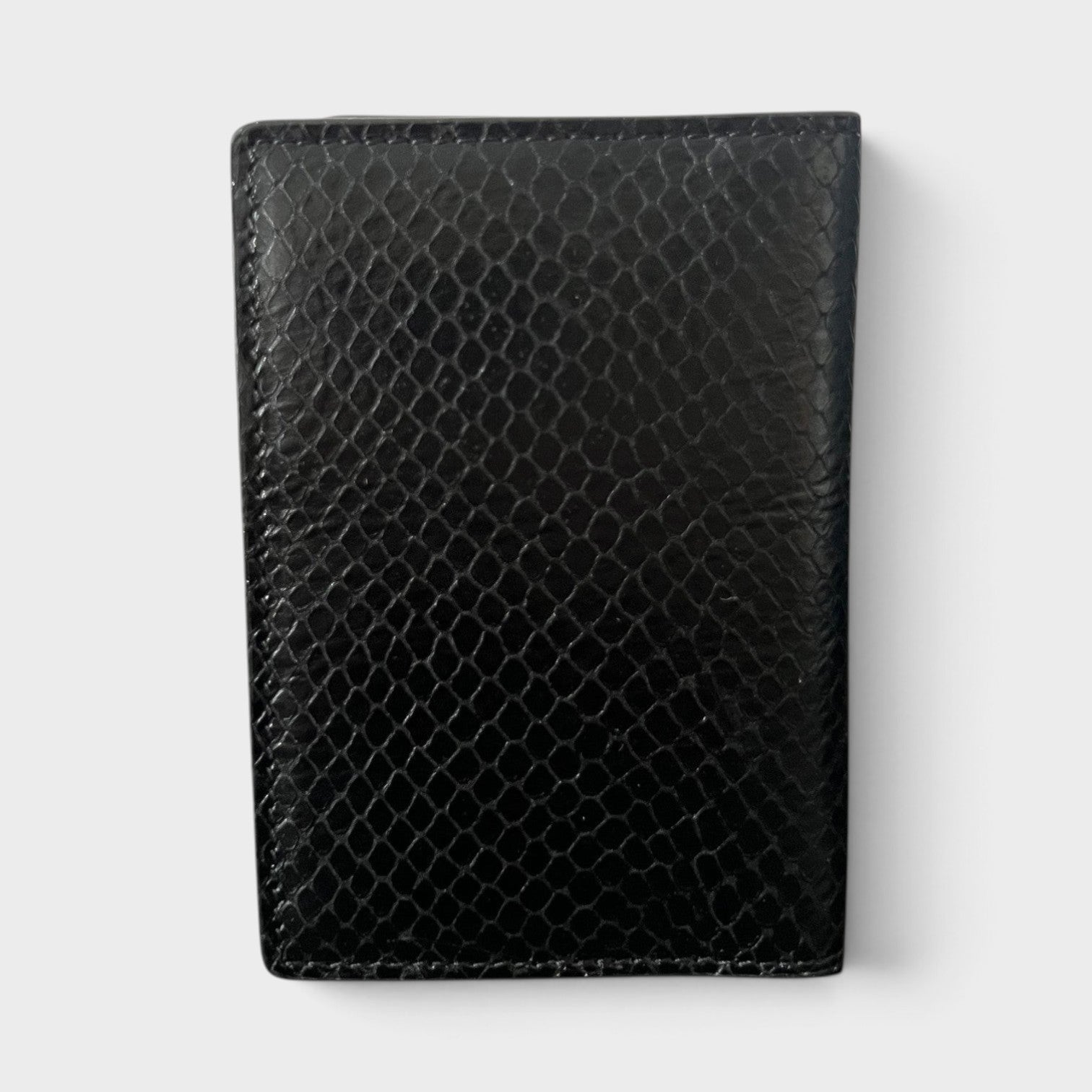 Supplied Fashion black leather card case with a textured snakeskin pattern in a compact, structured silhouette.