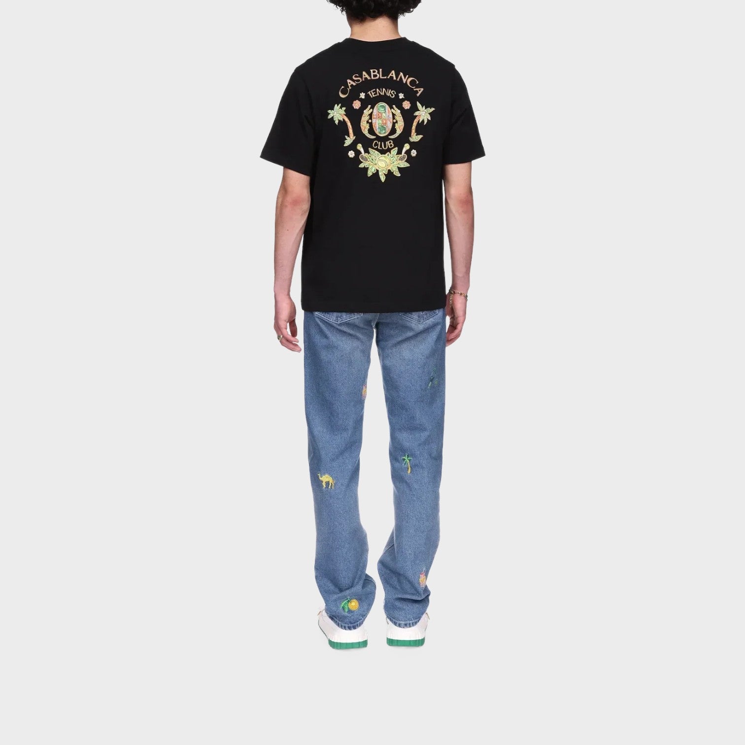 Supplied Fashion black short sleeve t-shirt with Casablanca Tennis Club graphic on back, worn with embroidered jeans.