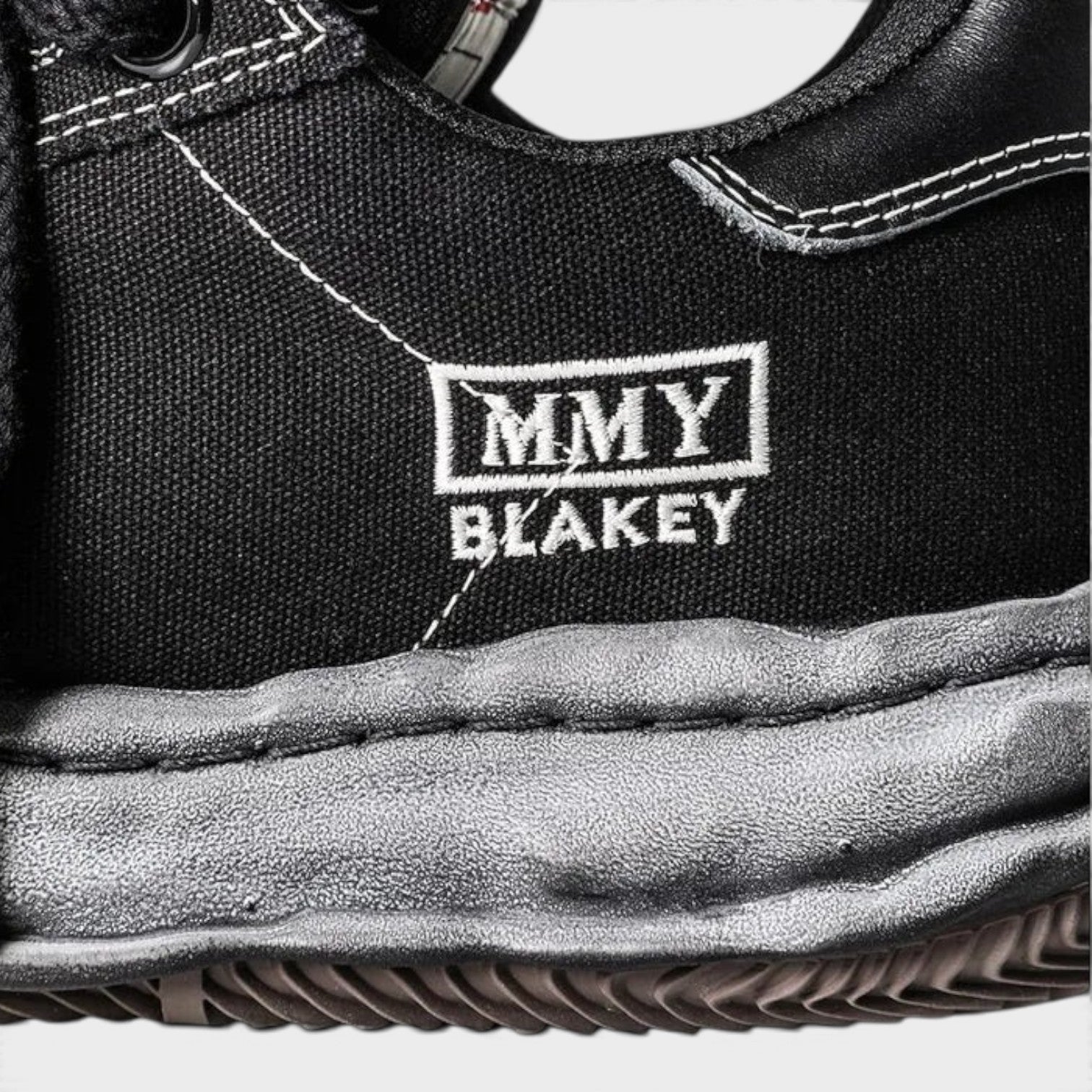 Supplied Fashion Maison Mihara Yasuhiro Blakey black canvas sneaker with signature distressed OG sole and MMY logo