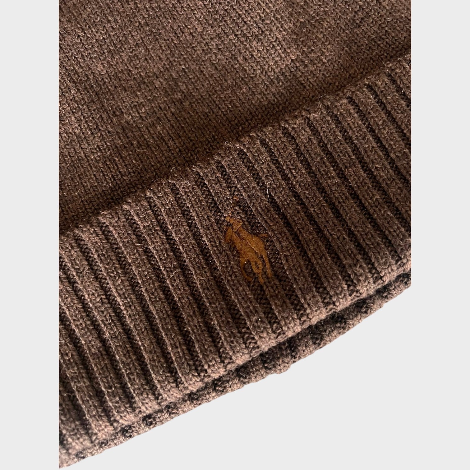 Supplied Fashion brown ribbed knit beanie with a tonal embroidered pony logo on the folded cuff