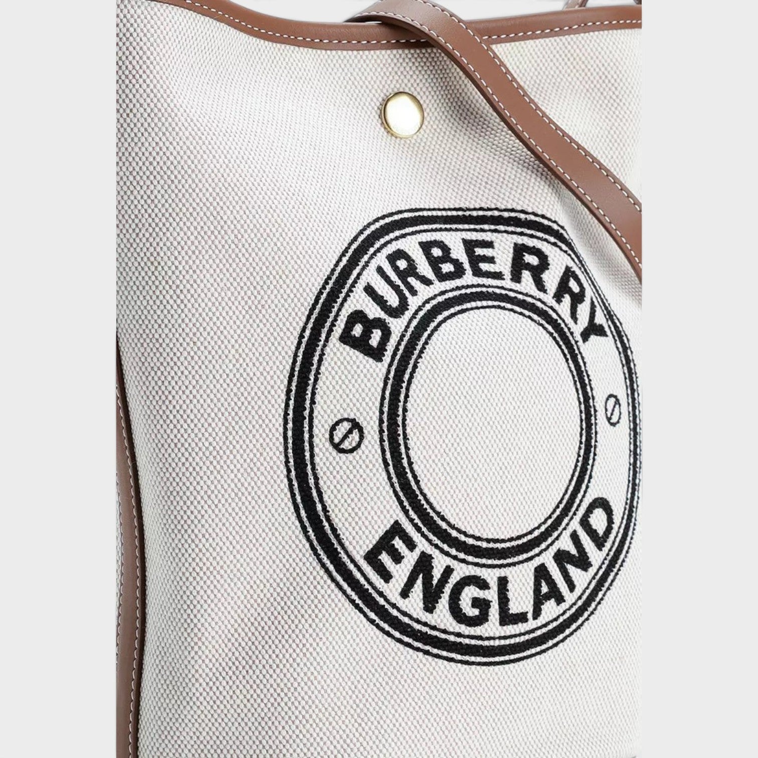 Supplied Fashion Burberry Roundel bucket bag in dark wheat beige canvas with brown leather trim and logo detail