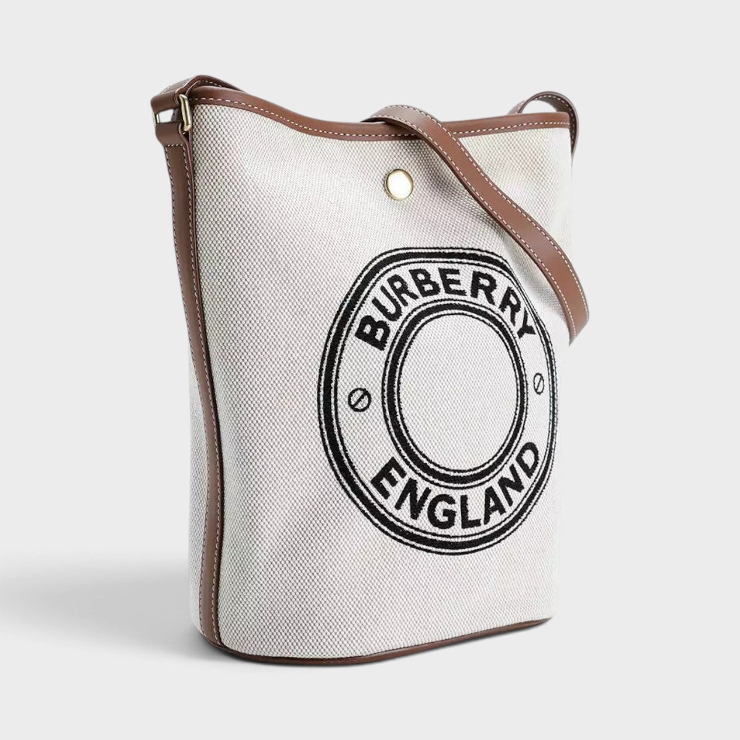 Supplied Fashion Burberry Roundel medium bucket bag in dark wheat beige canvas with brown leather trim and logo detail