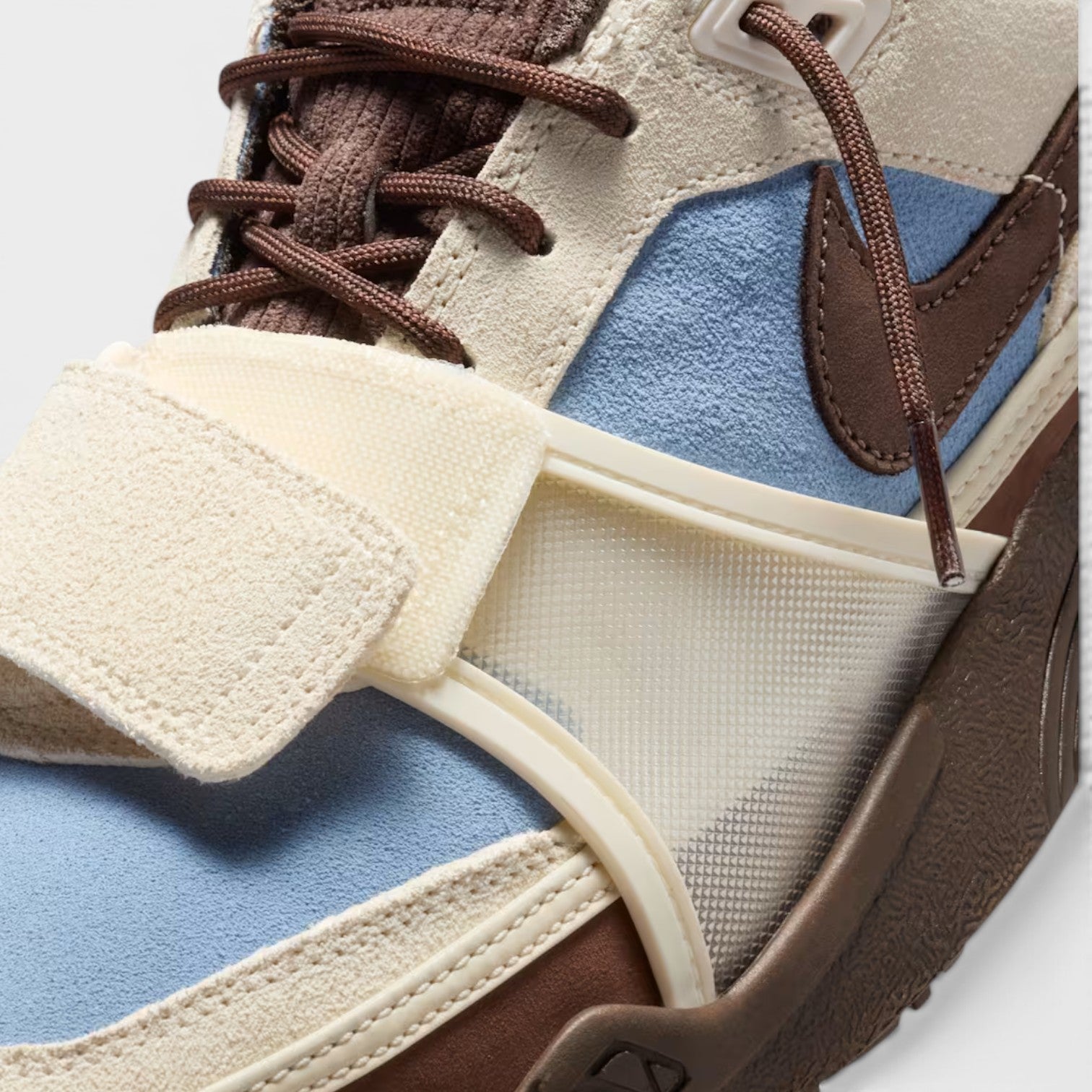 Supplied Fashion Cactus Jack Zoom Field Jaxx sneaker in pale ivory and blue suede with brown accents and velcro strap