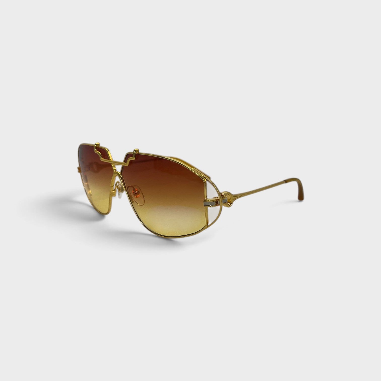 Supplied Fashion stainless steel aviator sunglasses with gold frames and brown gradient lenses on a white background.