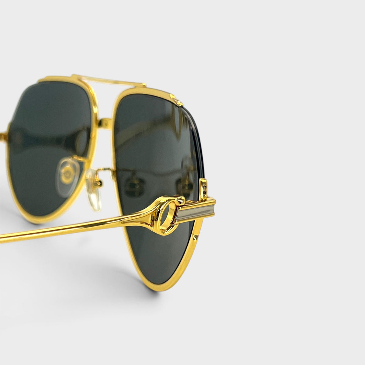Supplied Fashion rounded gold and black sunglasses with a detailed metallic temple hinge and dark UV-protective lenses.