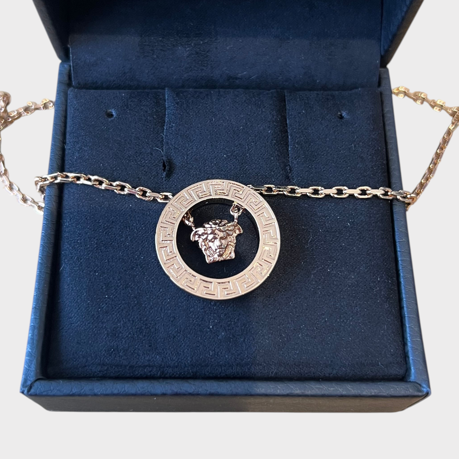 Supplied Fashion gold Medusa head pendant necklace with a Greek key circular frame inside a black jewelry box