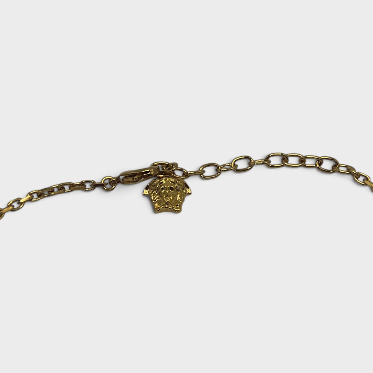 Supplied Fashion gold Medusa Greca necklace featuring a detailed Medusa head charm on a delicate chain link