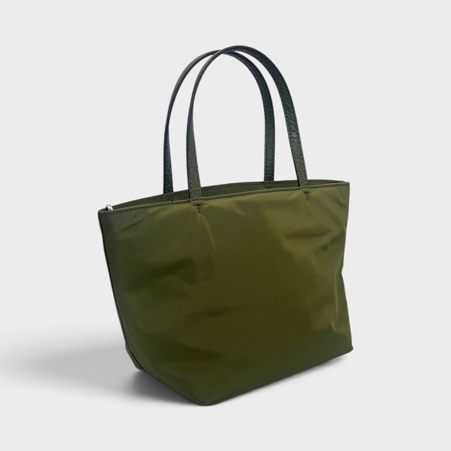 Supplied Fashion green khaki nylon mini tote bag with dual top handles in a studio setting