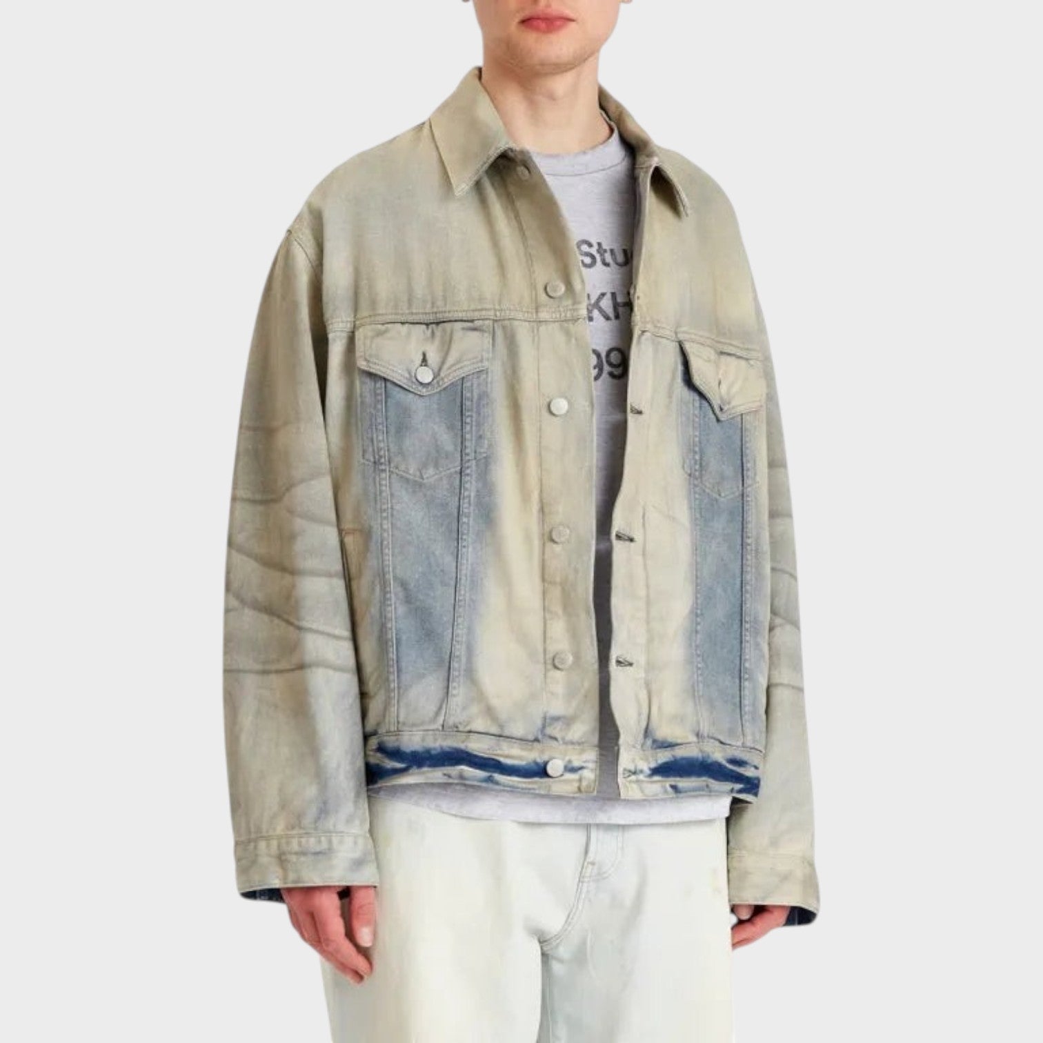 Supplied Fashion Robert U Carver light blue denim trucker jacket with a vintage distressed wash and button front.