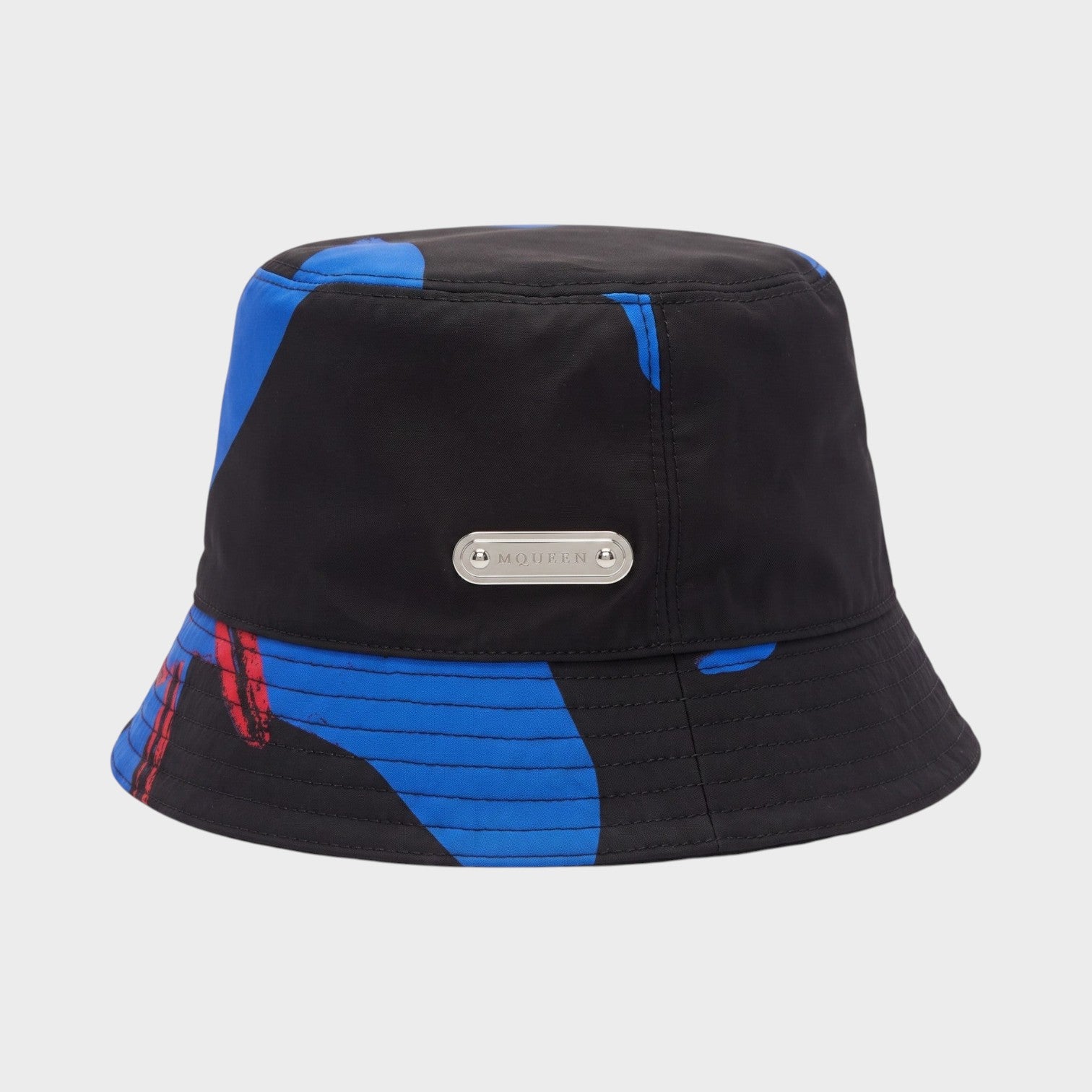 Supplied Fashion Lily bucket hat in black and blue with a structured brim and silver logo plaque detail