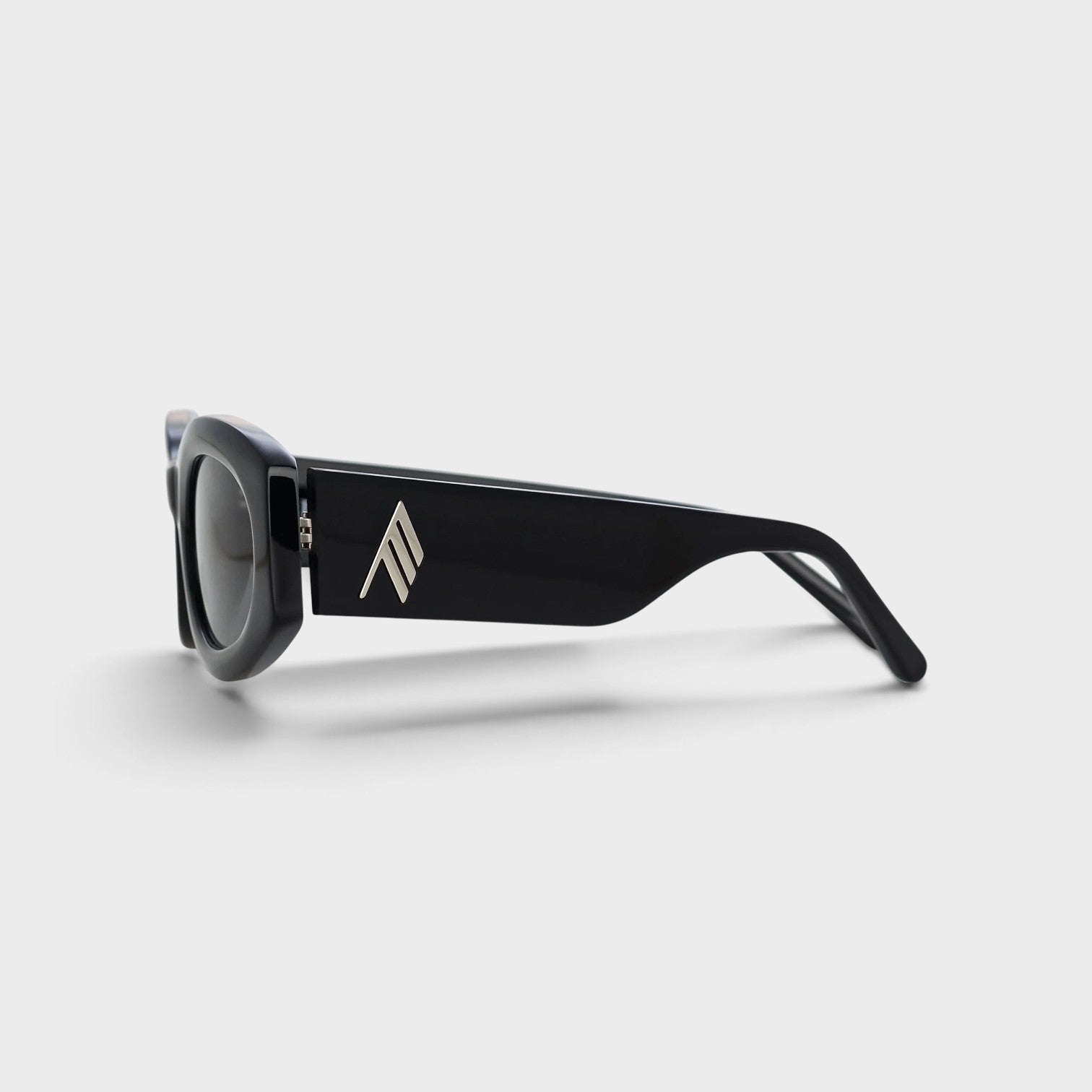 Supplied Fashion Linda Farrow Berta black sunglasses with a thick frame and silver logo detail on the temple