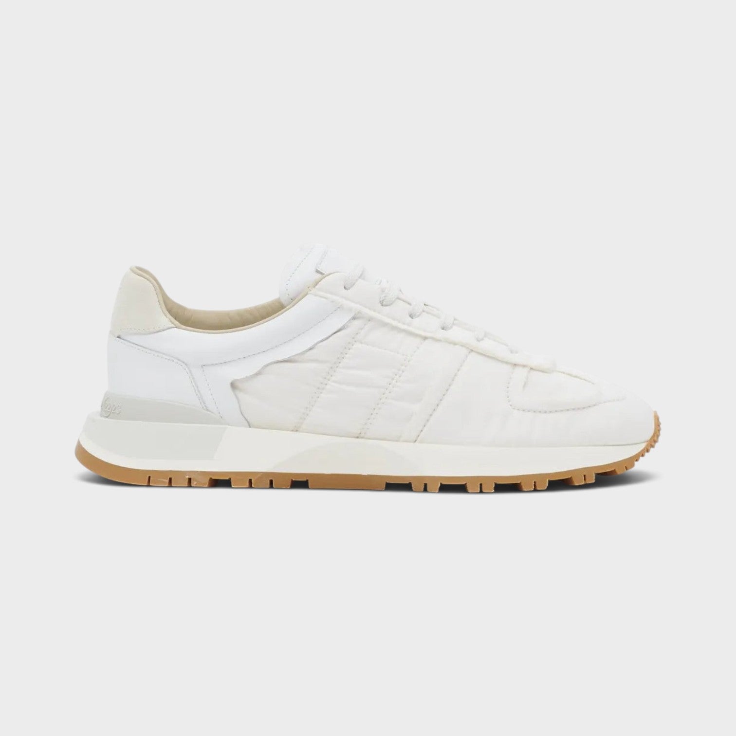 Supplied Fashion Maison Margiela 50-50 white sneakers featuring a mixed leather and textile upper with a gum sole.