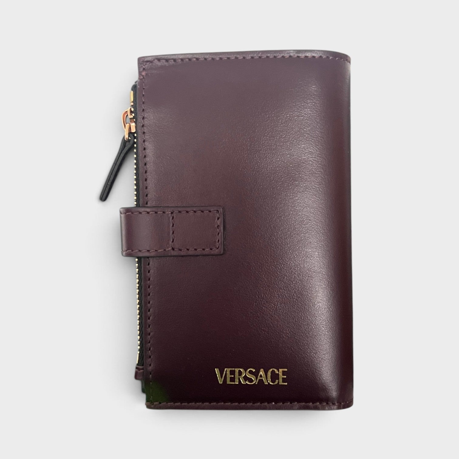 Supplied Fashion maroon brown calf leather compact wallet with gold-tone zipper and embossed logo detail.