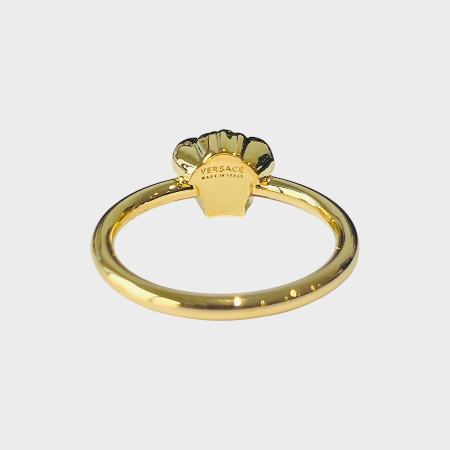 Supplied Fashion gold tone metal Medusa head ring with intricate detailing. Classic mythological design.