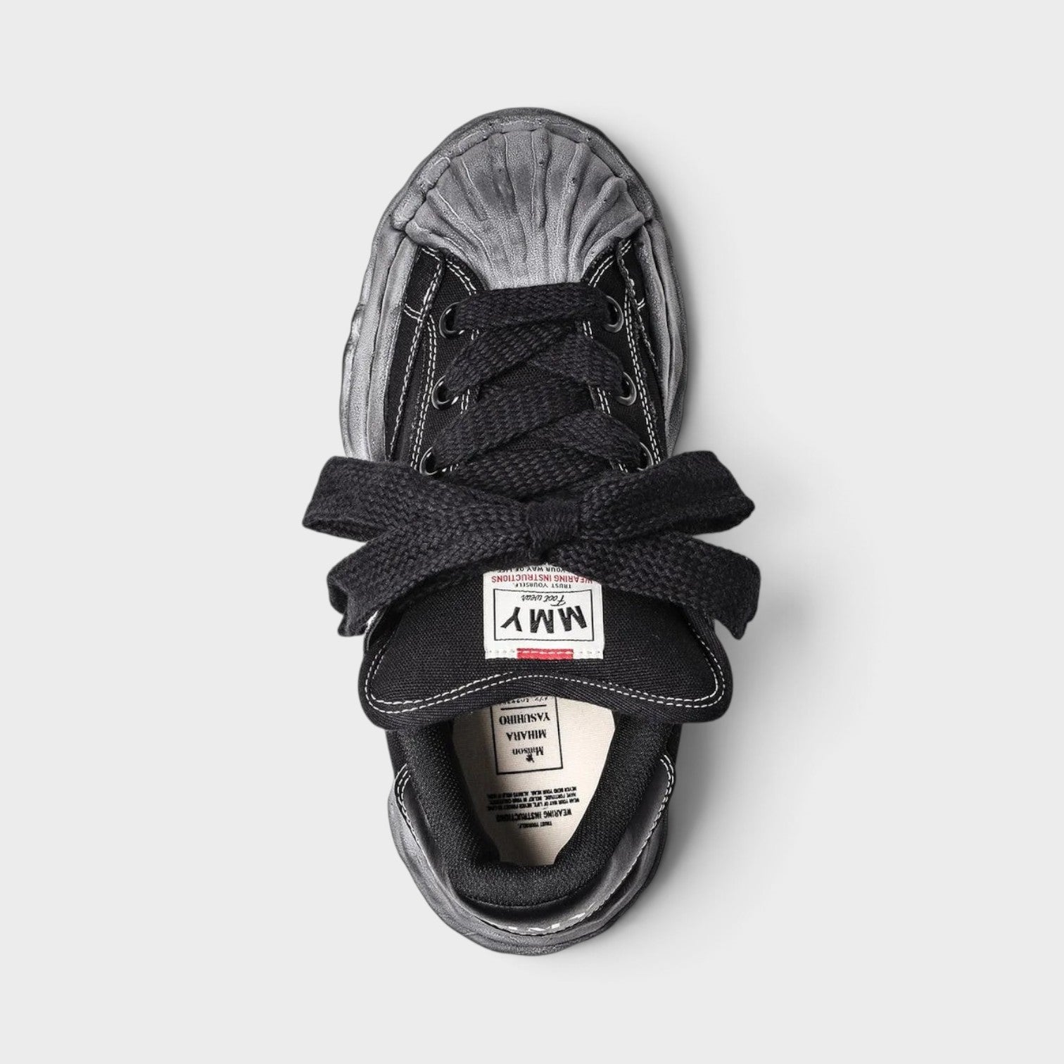 Supplied Fashion Maison Mihara Yasuhiro Blakey Puffer black canvas sneaker with signature distressed OG sole top view
