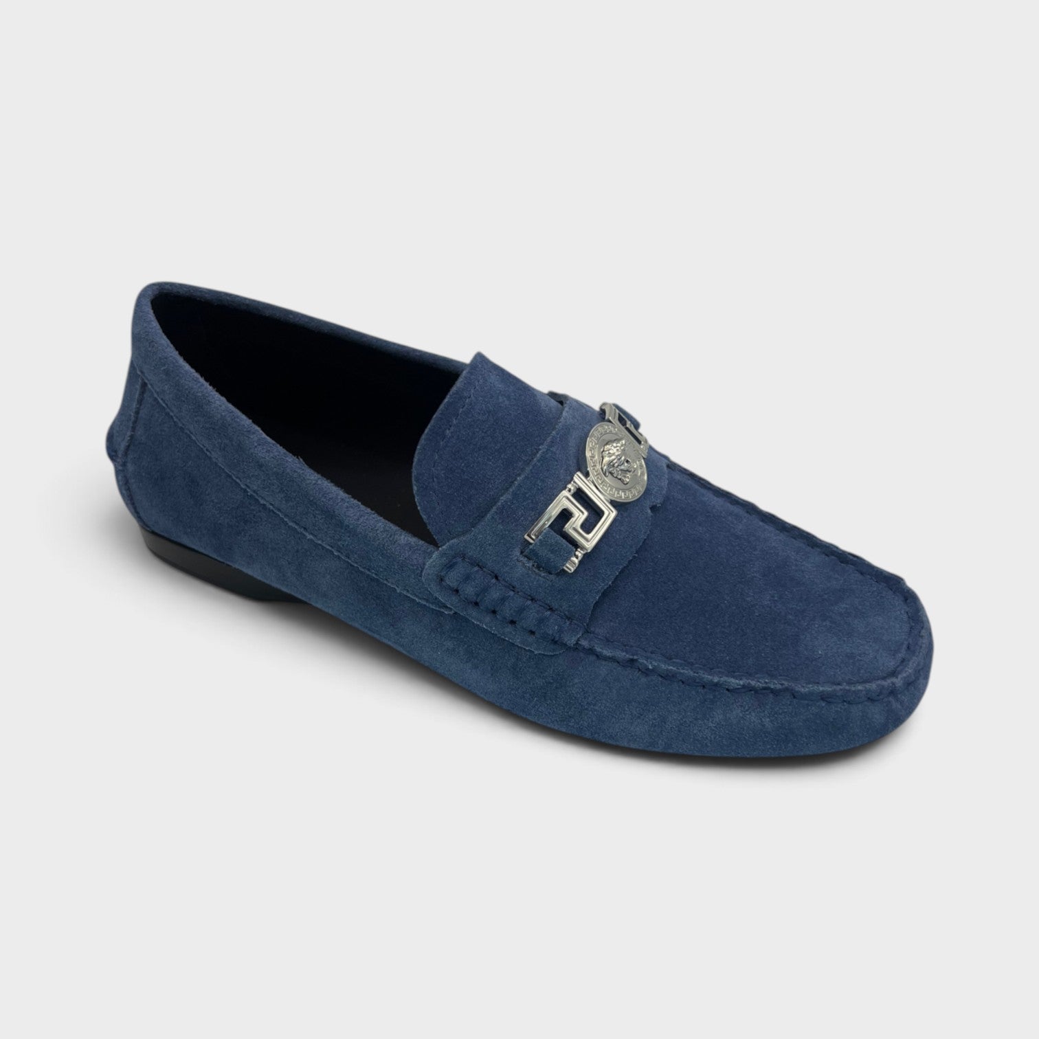 Supplied Fashion navy suede Medusa Greca driver loafer with silver signature hardware and flexible sole.