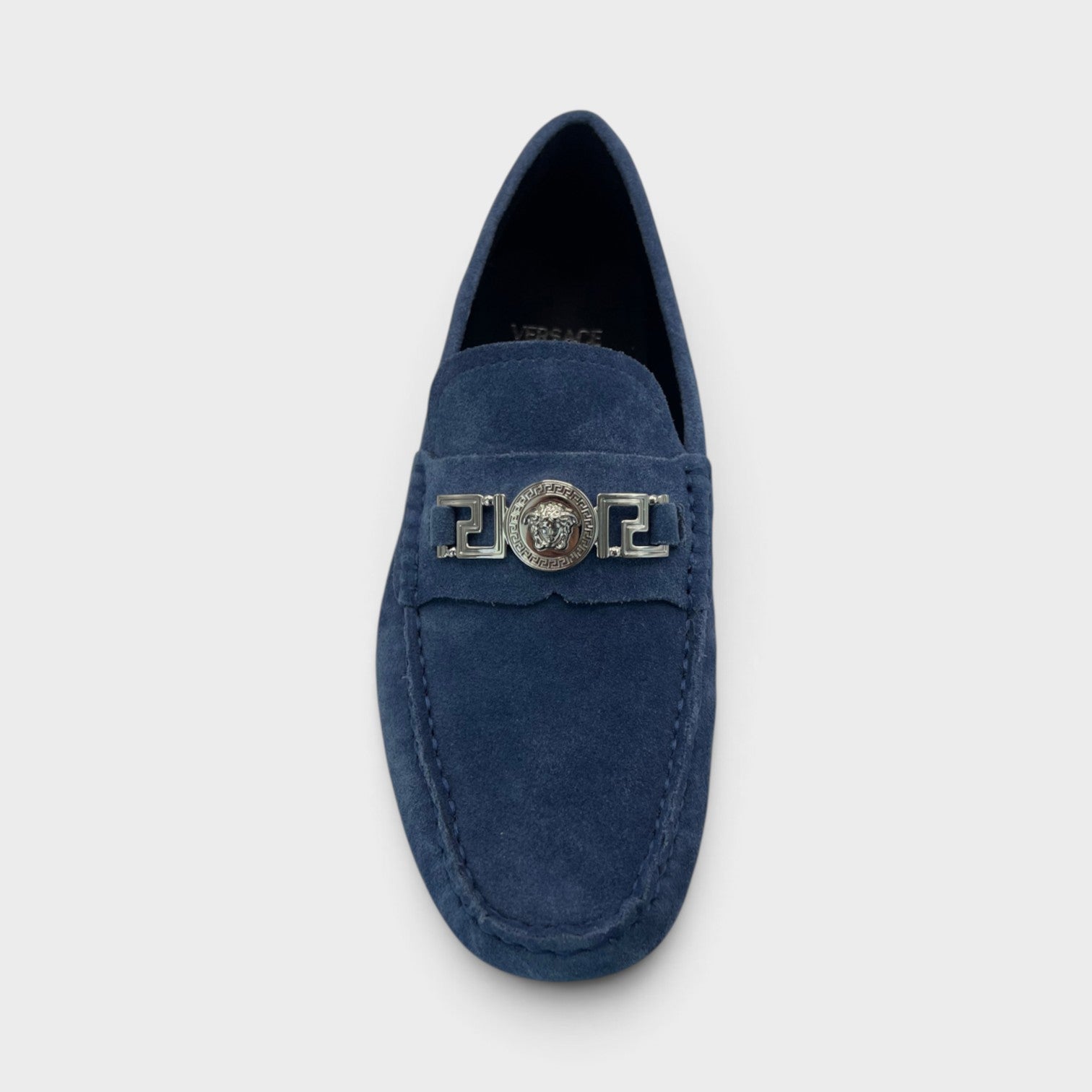 Supplied Fashion dark navy suede driver loafer with silver Versace Medusa Greca metal hardware detail