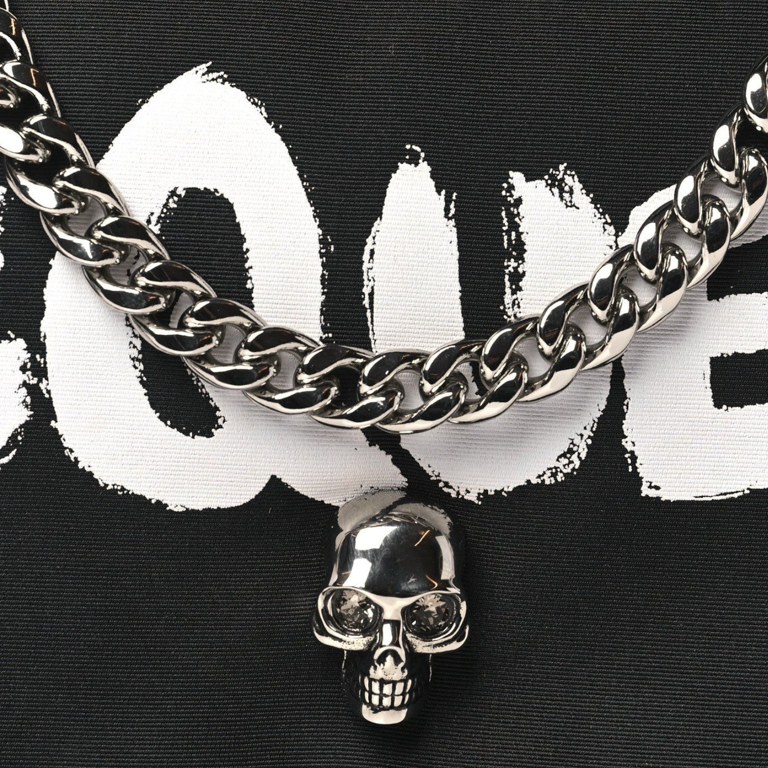 Supplied Fashion nylon crossbody bag featuring a silver skull charm and chain detail on a black and white print