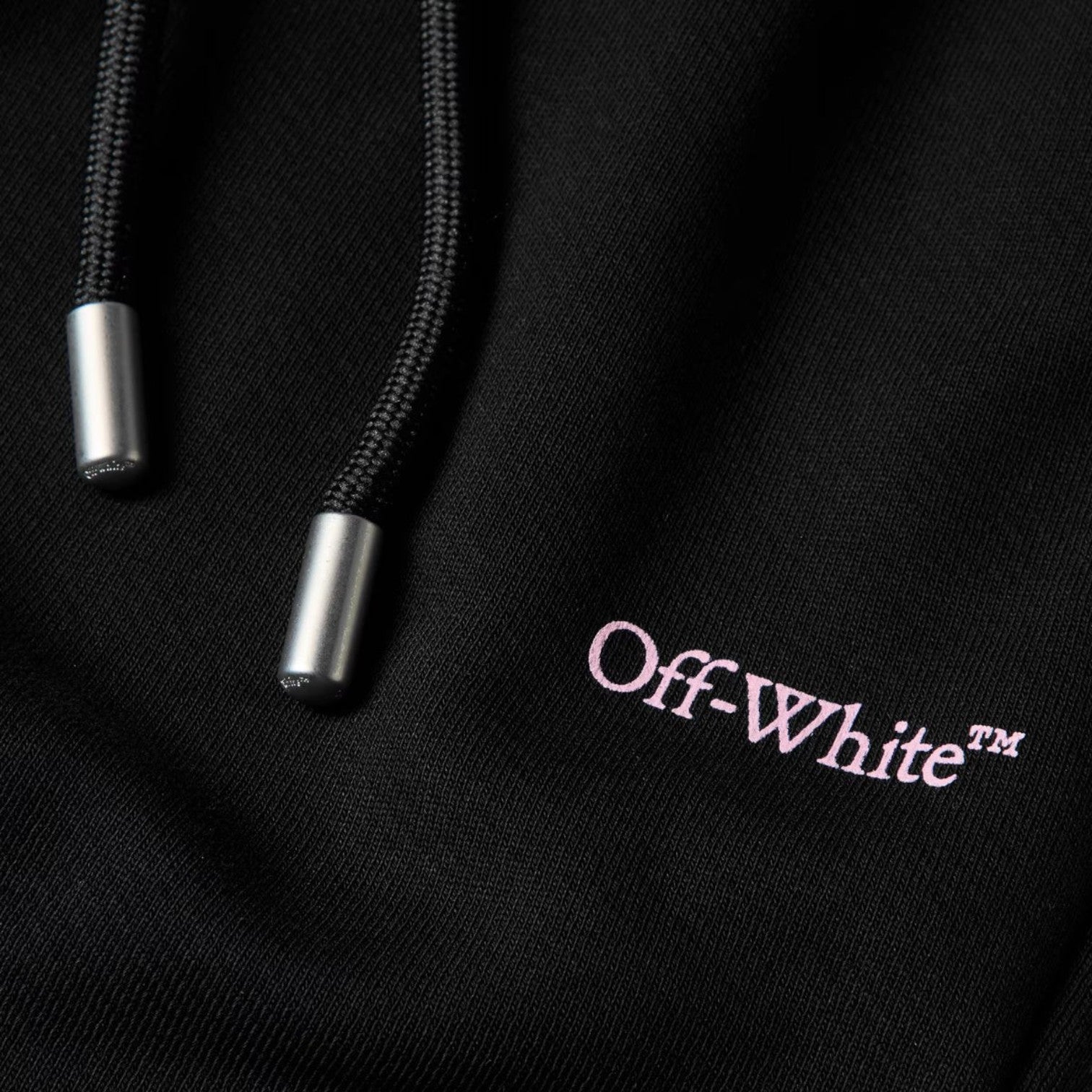 Supplied Fashion Off-White fleece sweatpants featuring black drawstring cords with silver metal tips and logo detail