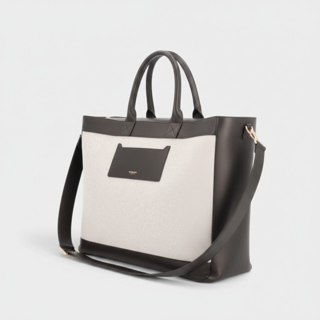 Supplied Fashion Burberry Ormond two-way tote bag in beige canvas and black leather with dual handles and shoulder strap