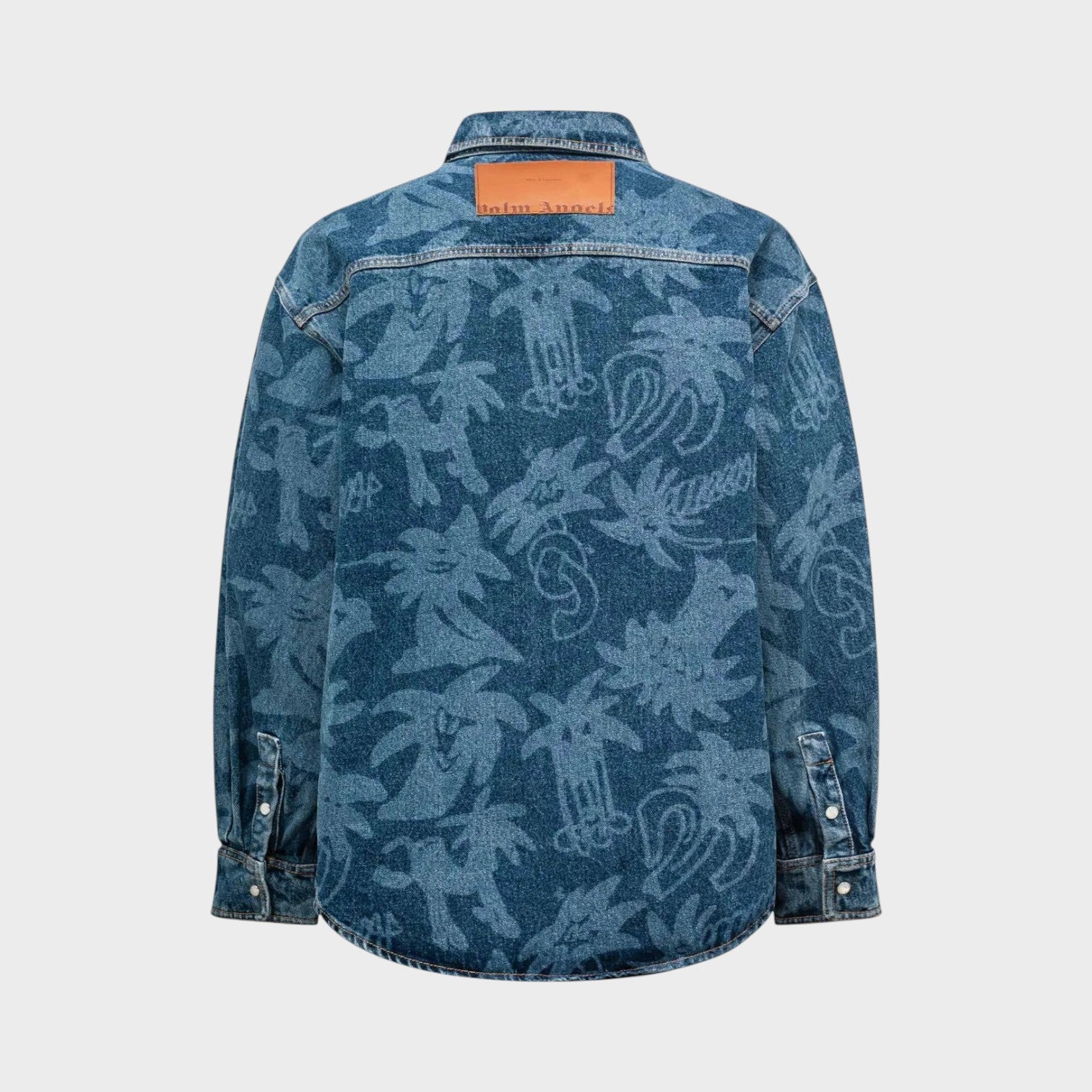Back view of Supplied Fashion Palm Angels oversized blue denim shirt with laser-printed palm tree patterns.