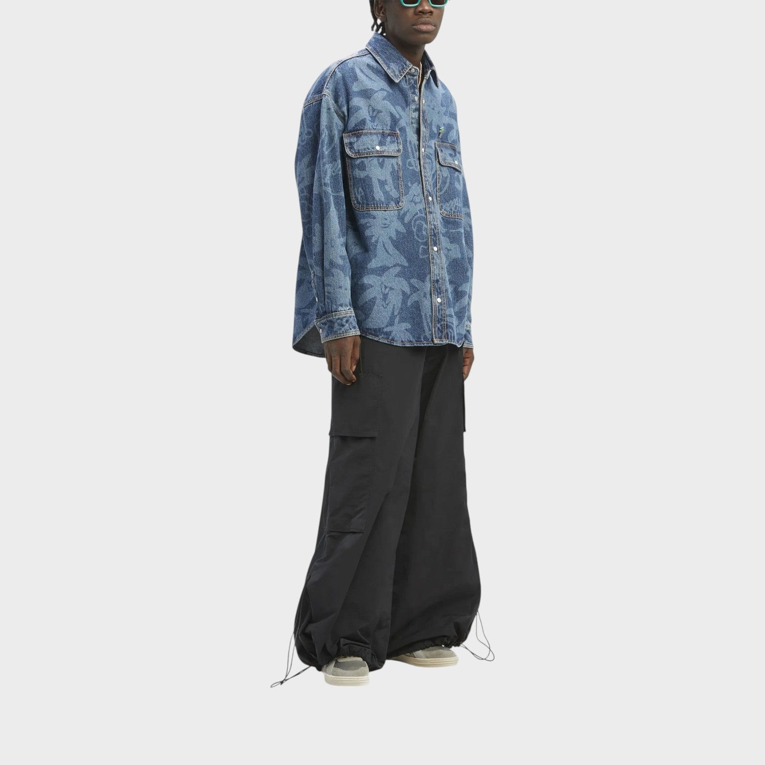 Supplied Fashion oversized blue denim shirt with Palmity laser print, worn by a model with black cargo pants.