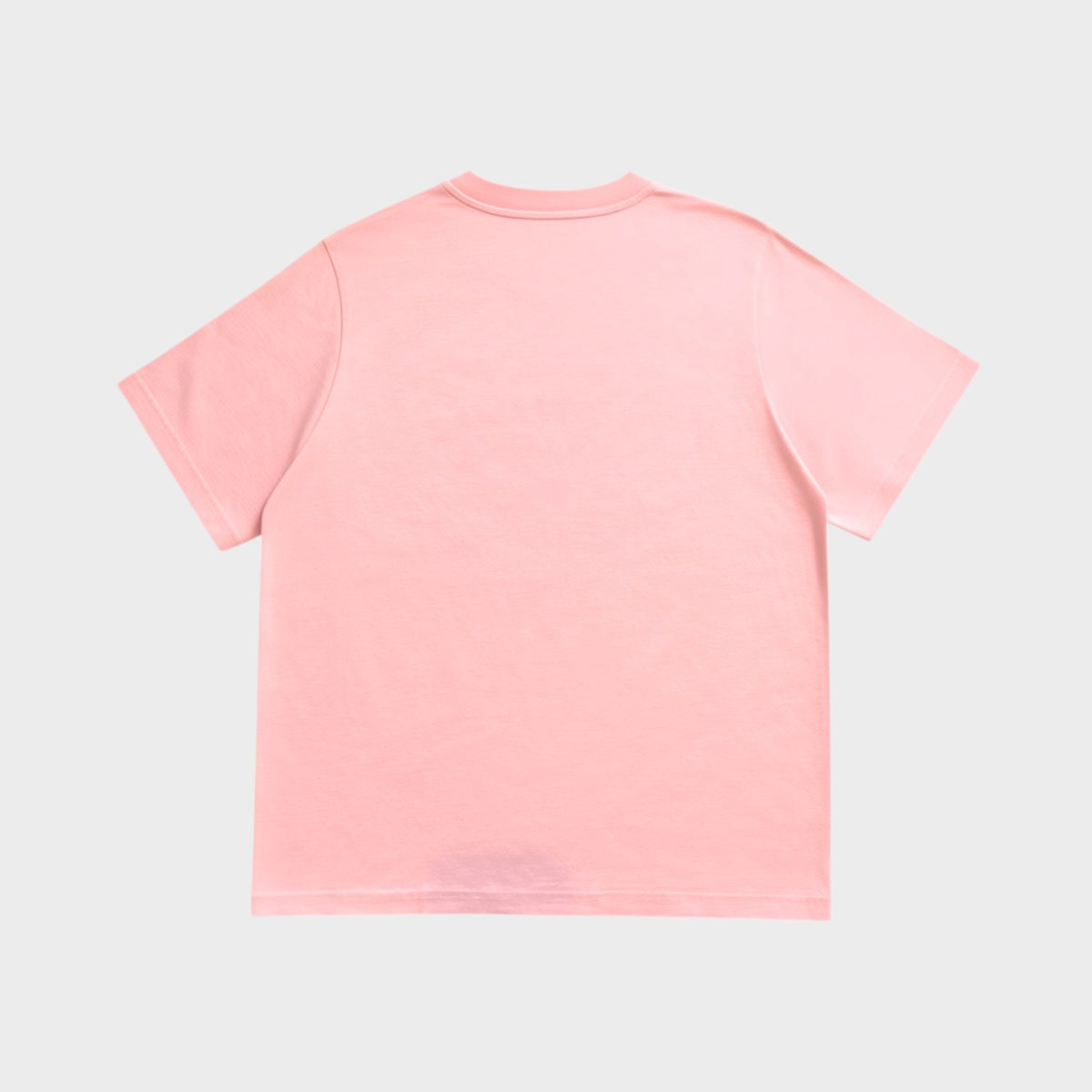 Back view of a Supplied Fashion pink cotton t-shirt with a relaxed fit and clean, minimalist design.