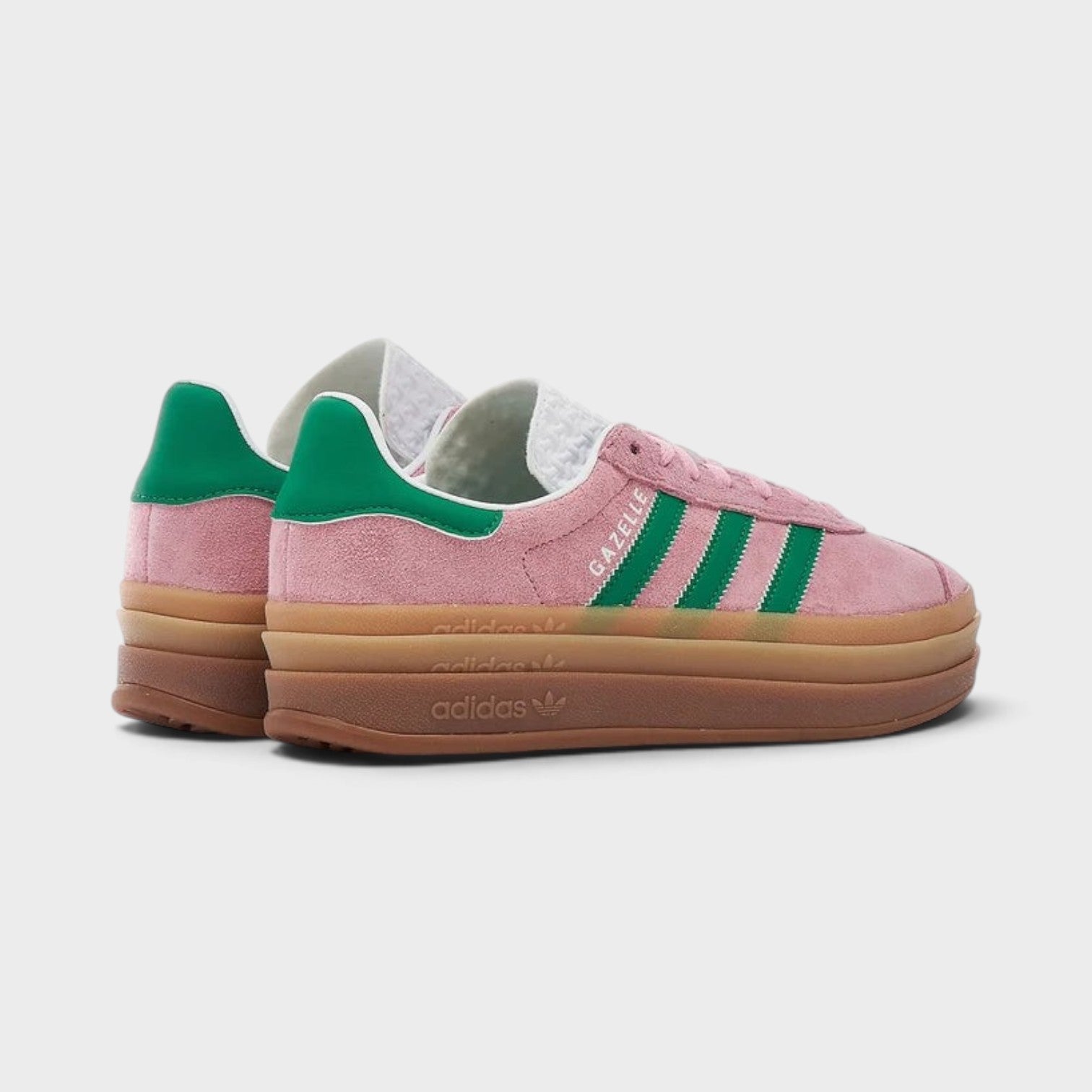 Supplied Fashion adidas Originals Gazelle Bold sneakers in true pink suede with green stripes and platform gum sole.