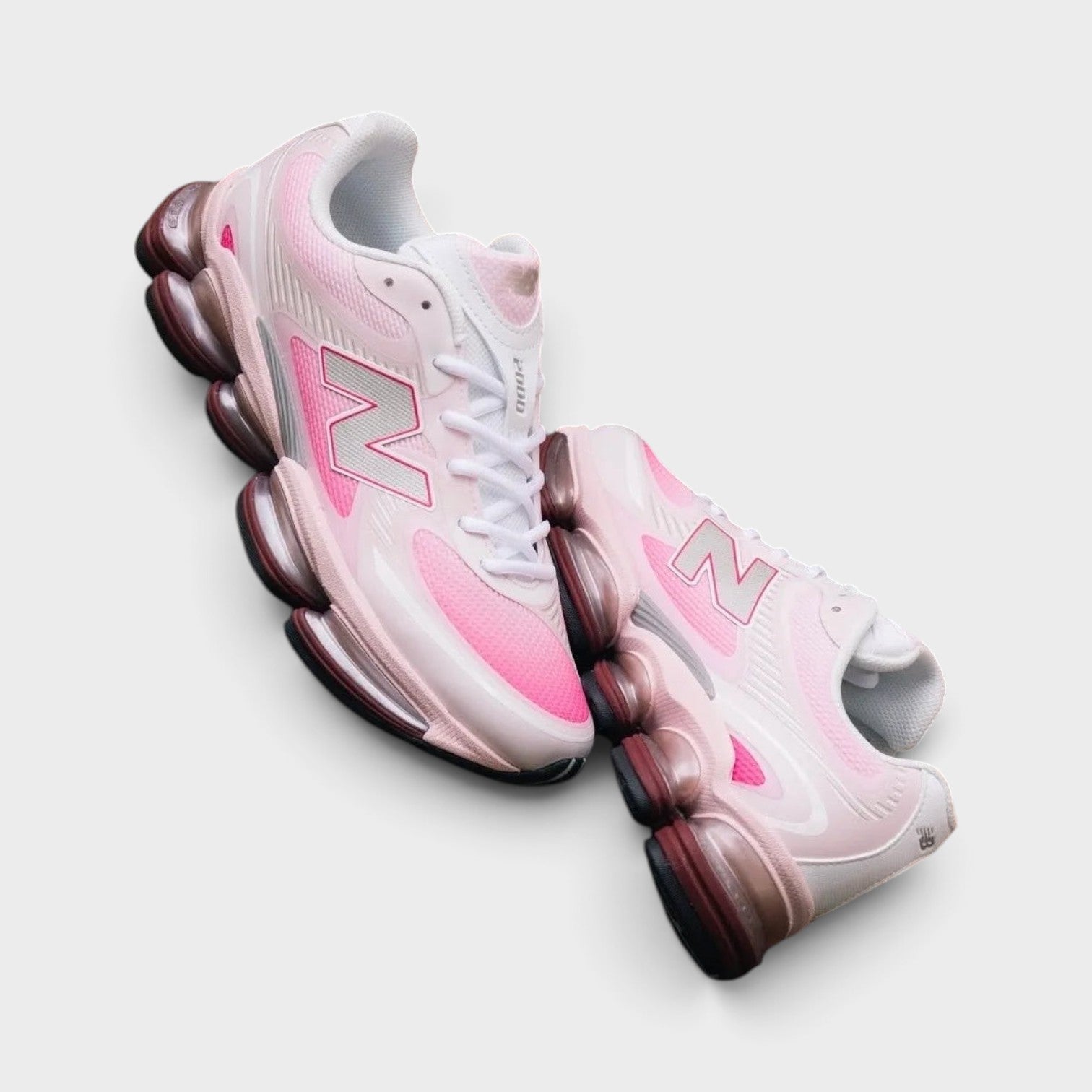 Supplied Fashion New Balance Abzorb 2000 sneakers in pink with mesh upper and responsive shock-absorbing midsole.