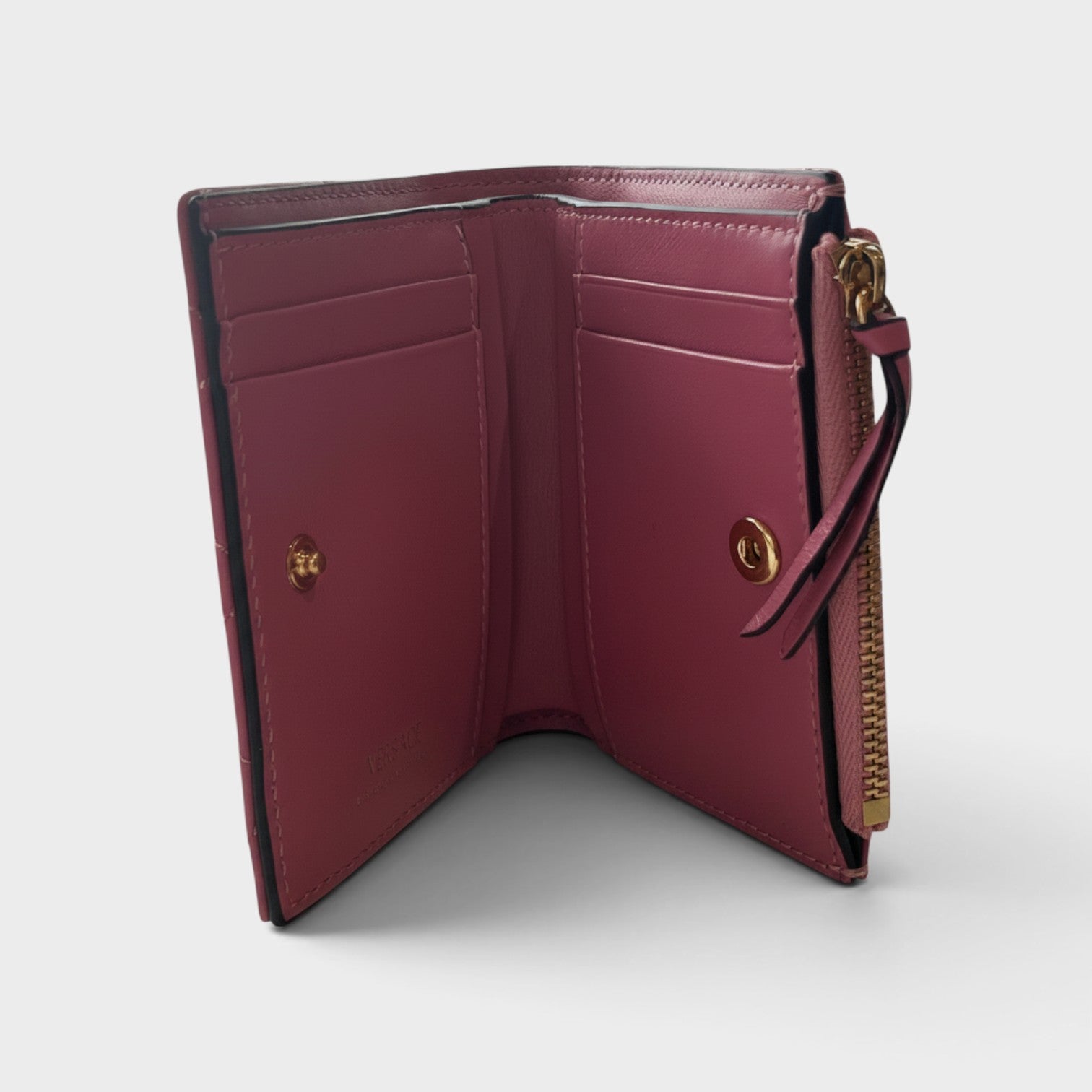 Supplied Fashion pink quilted leather wallet with gold zipper and interior card slots, open view