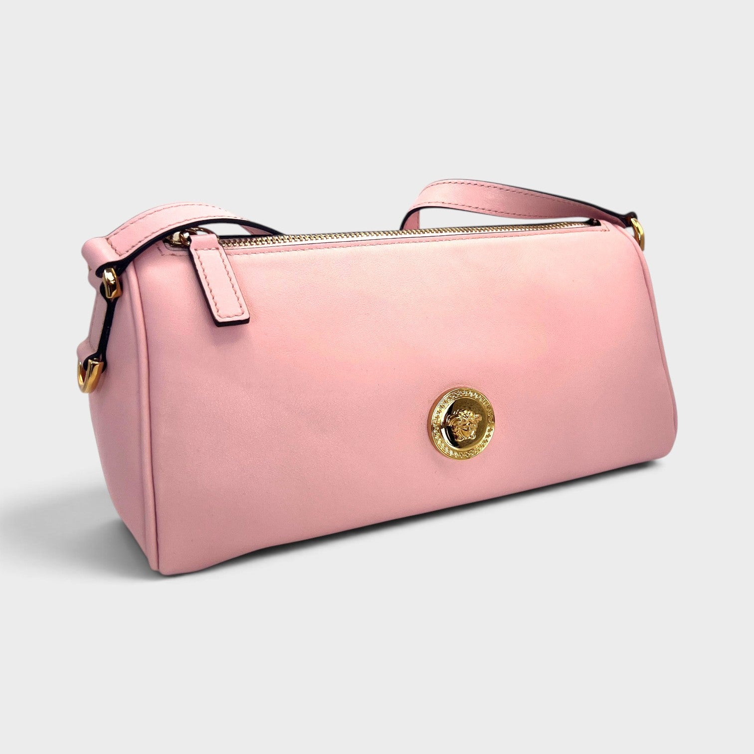 Supplied Fashion rose pink Versace Medusa crossbody bag with gold hardware and structured cylindrical silhouette
