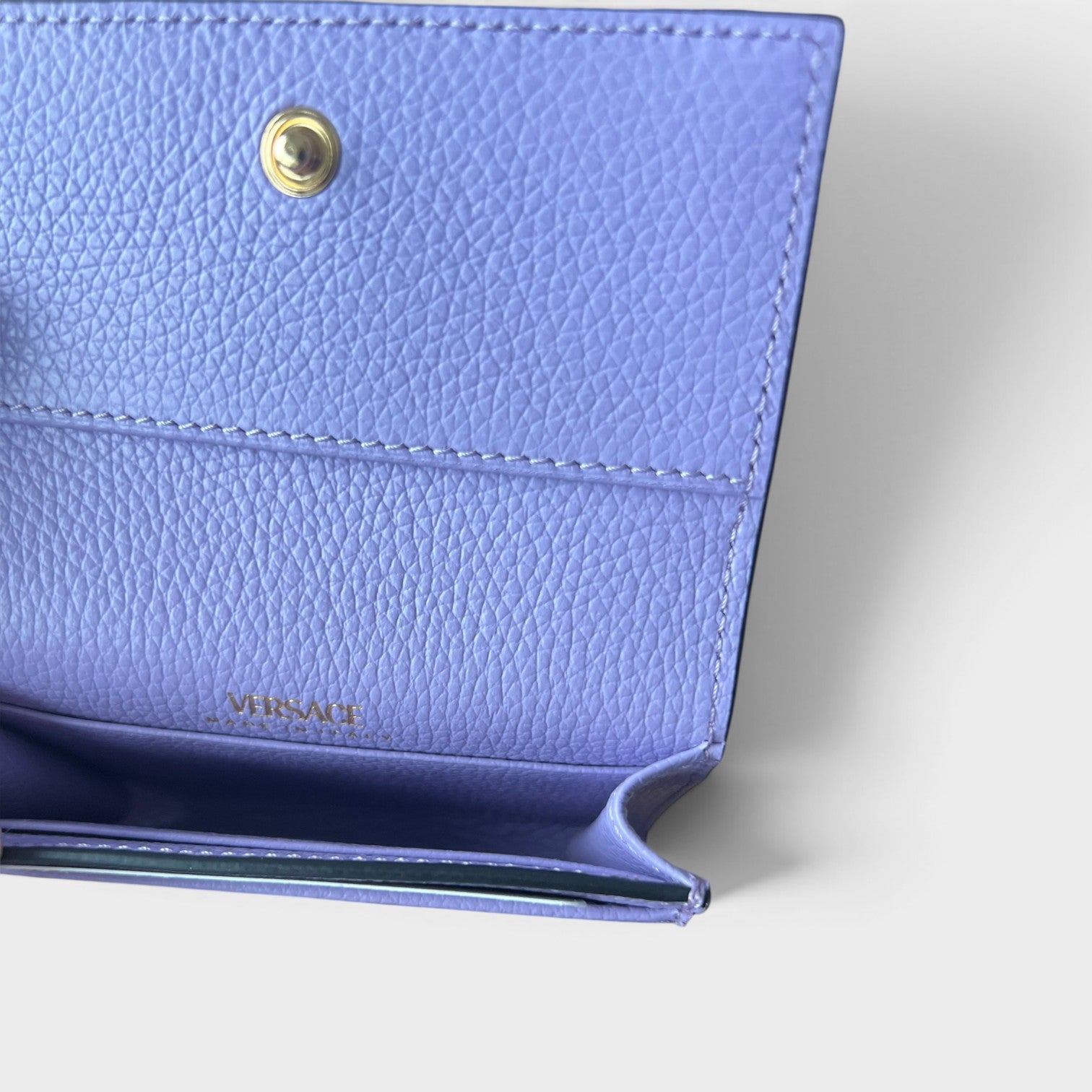 Supplied Fashion purple pebbled leather business card holder with gold snap button and interior logo branding