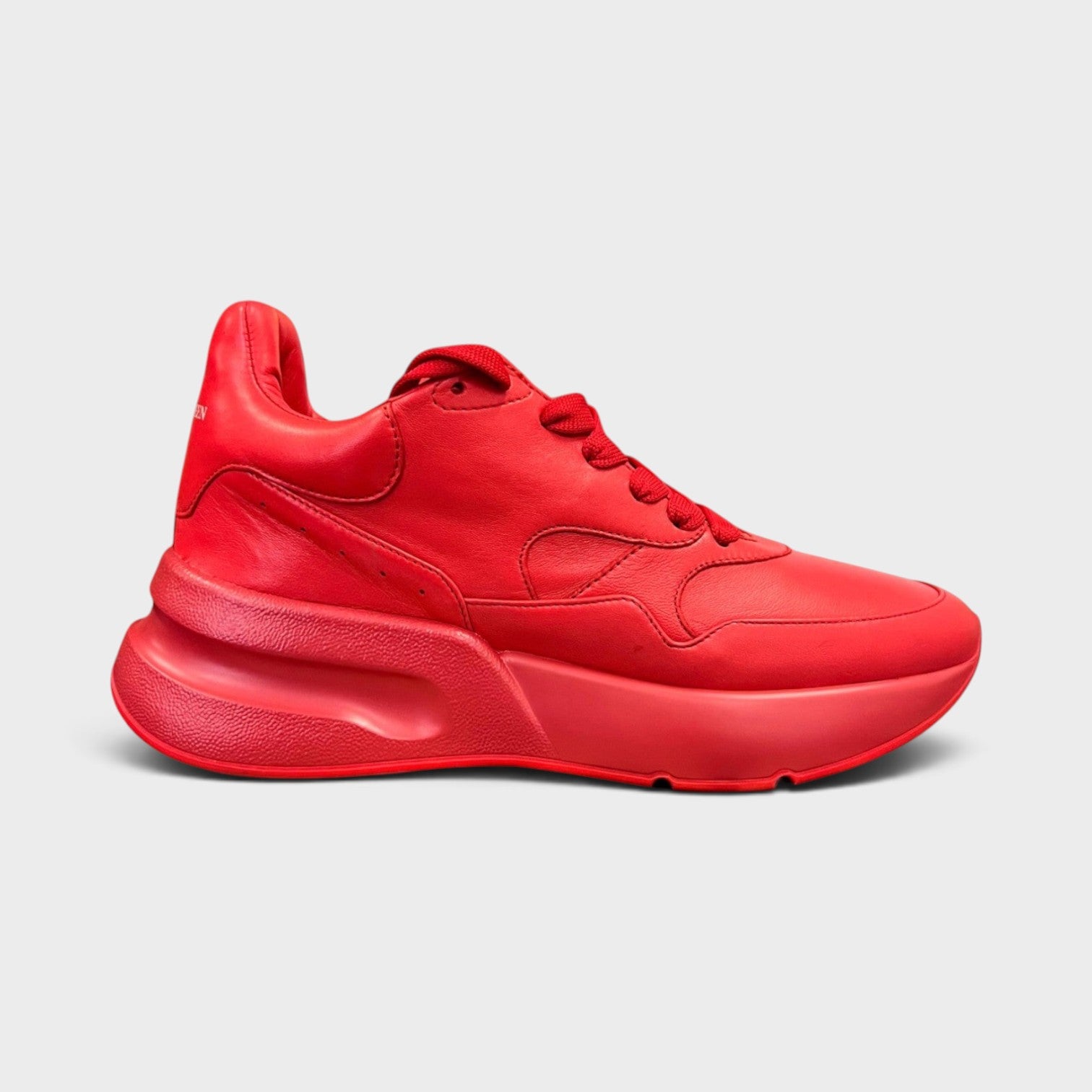 Supplied Fashion Alexander McQueen red leather oversized runner sneakers with a thick platform sole