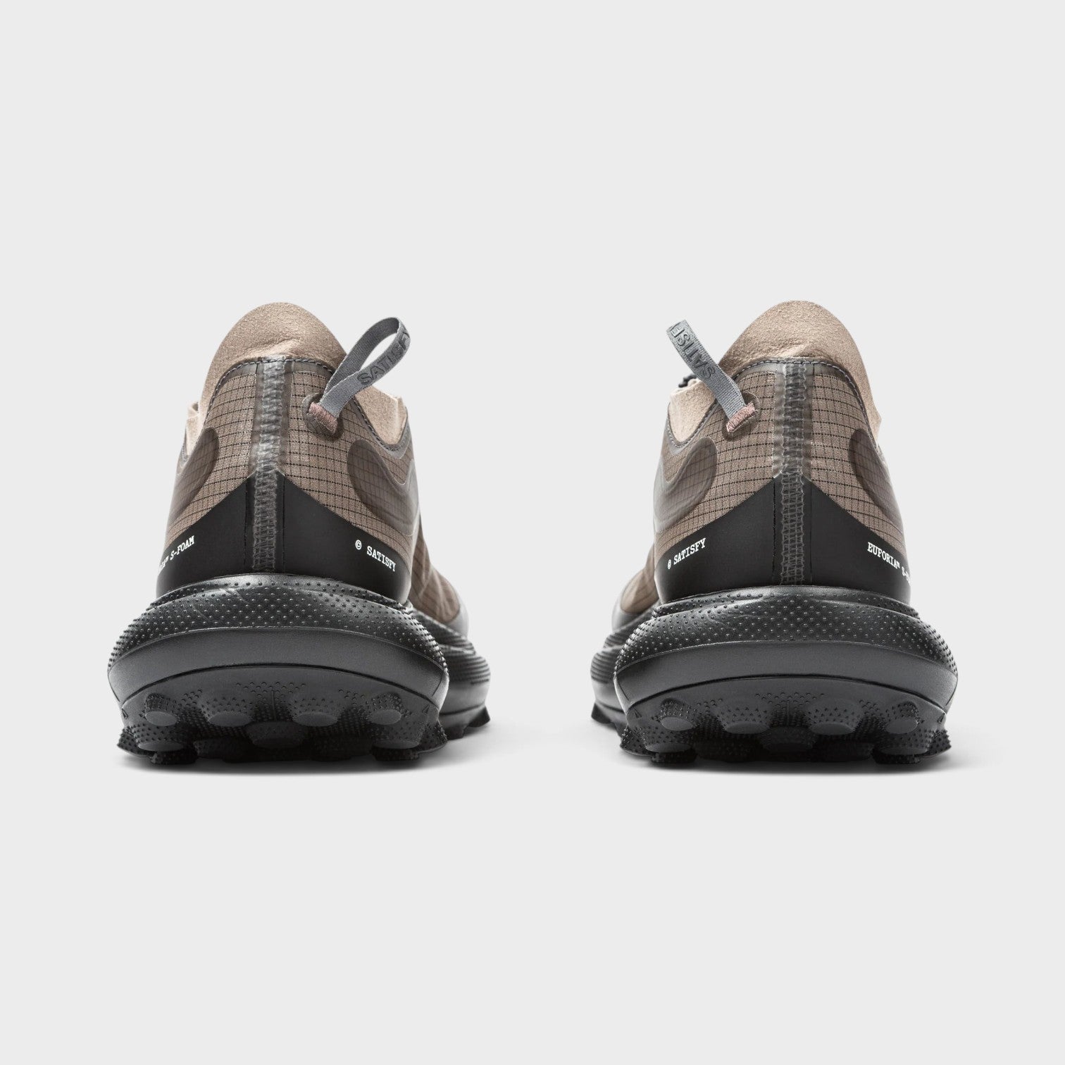 Supplied Fashion The Rocker sneakers in brown with a grid pattern, black textured sole, and rear pull tabs.