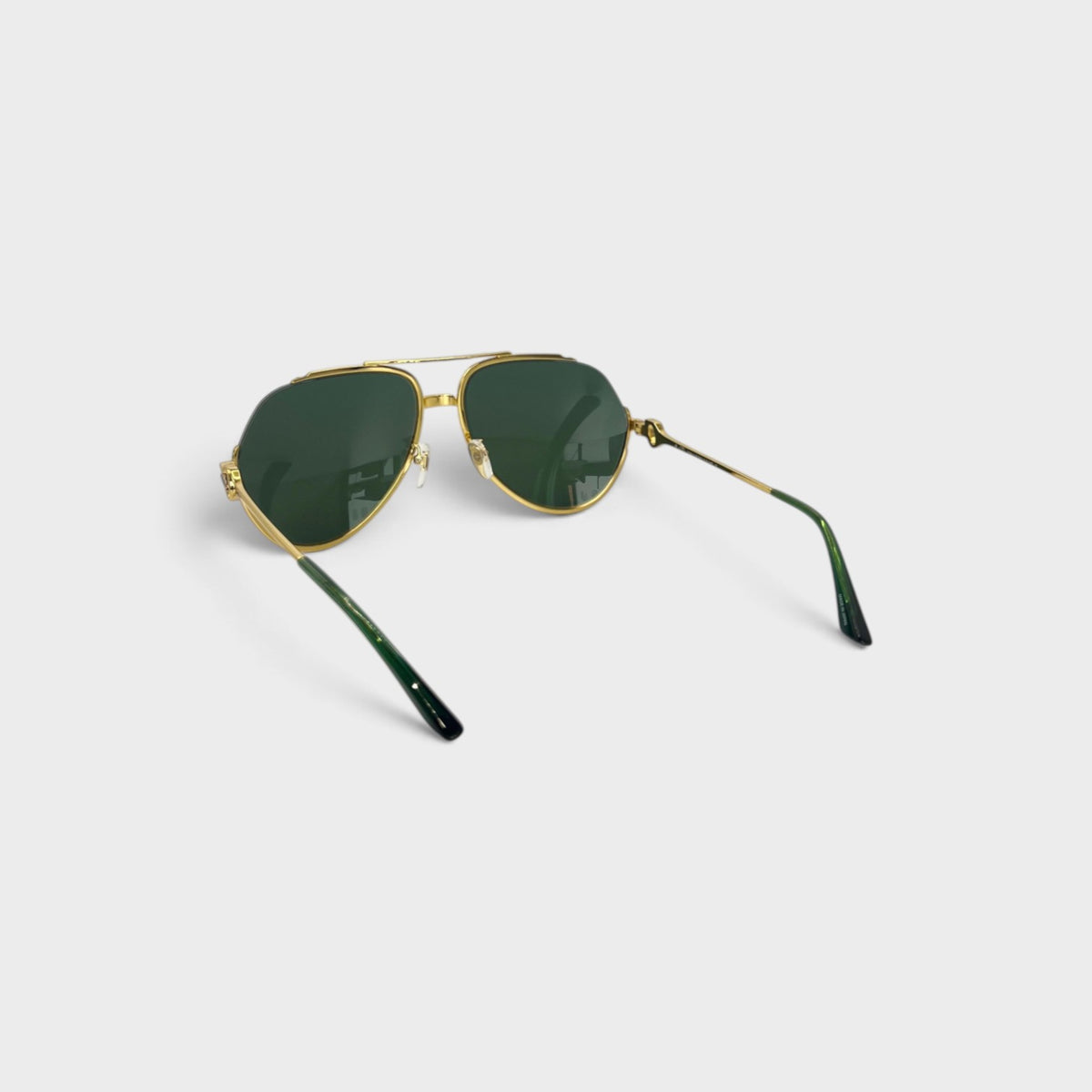 Supplied Fashion vintage-inspired rounded sunglasses with gold stainless steel frames and dark green lenses.