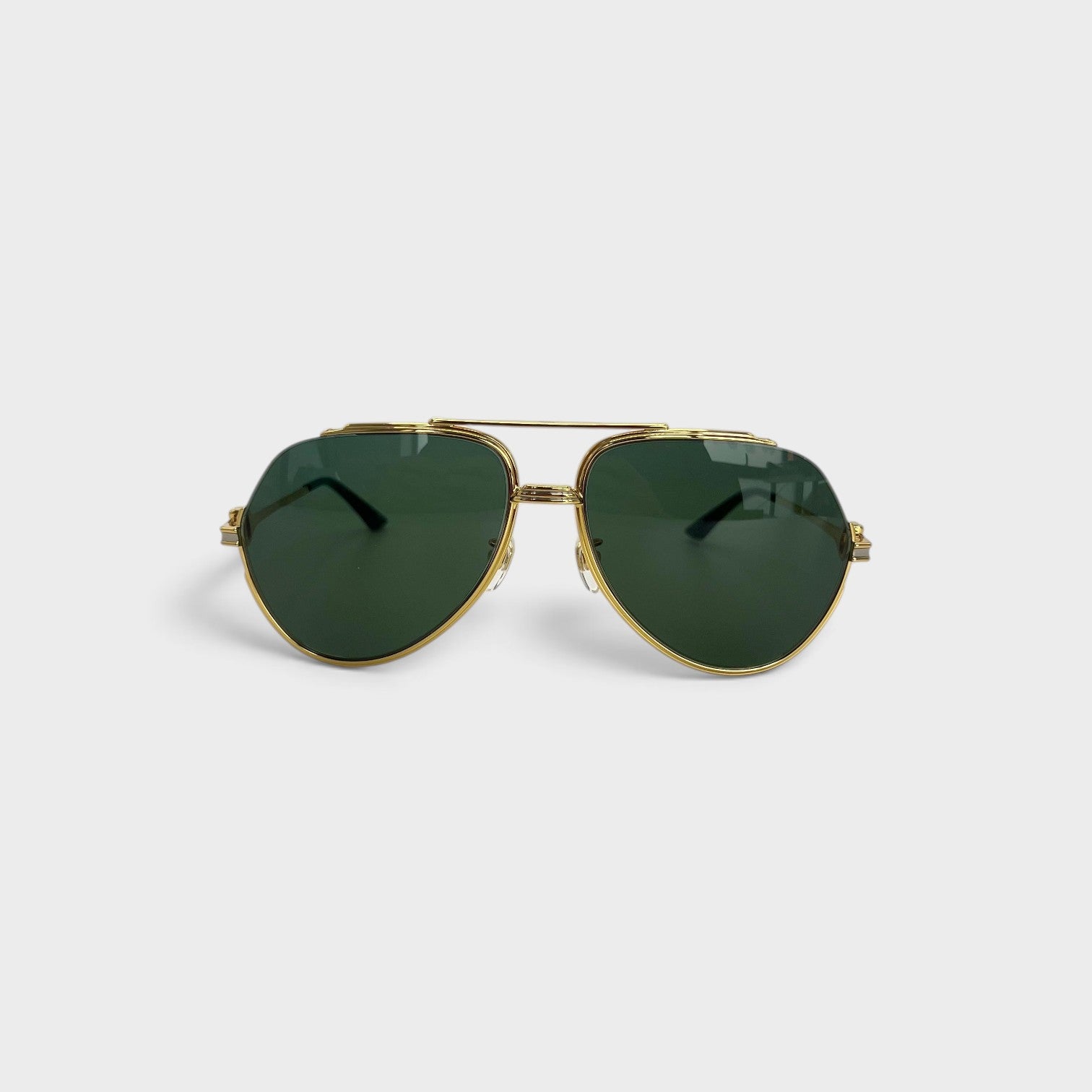 Supplied Fashion vintage-inspired rounded sunglasses with gold stainless steel frames and dark green lenses.
