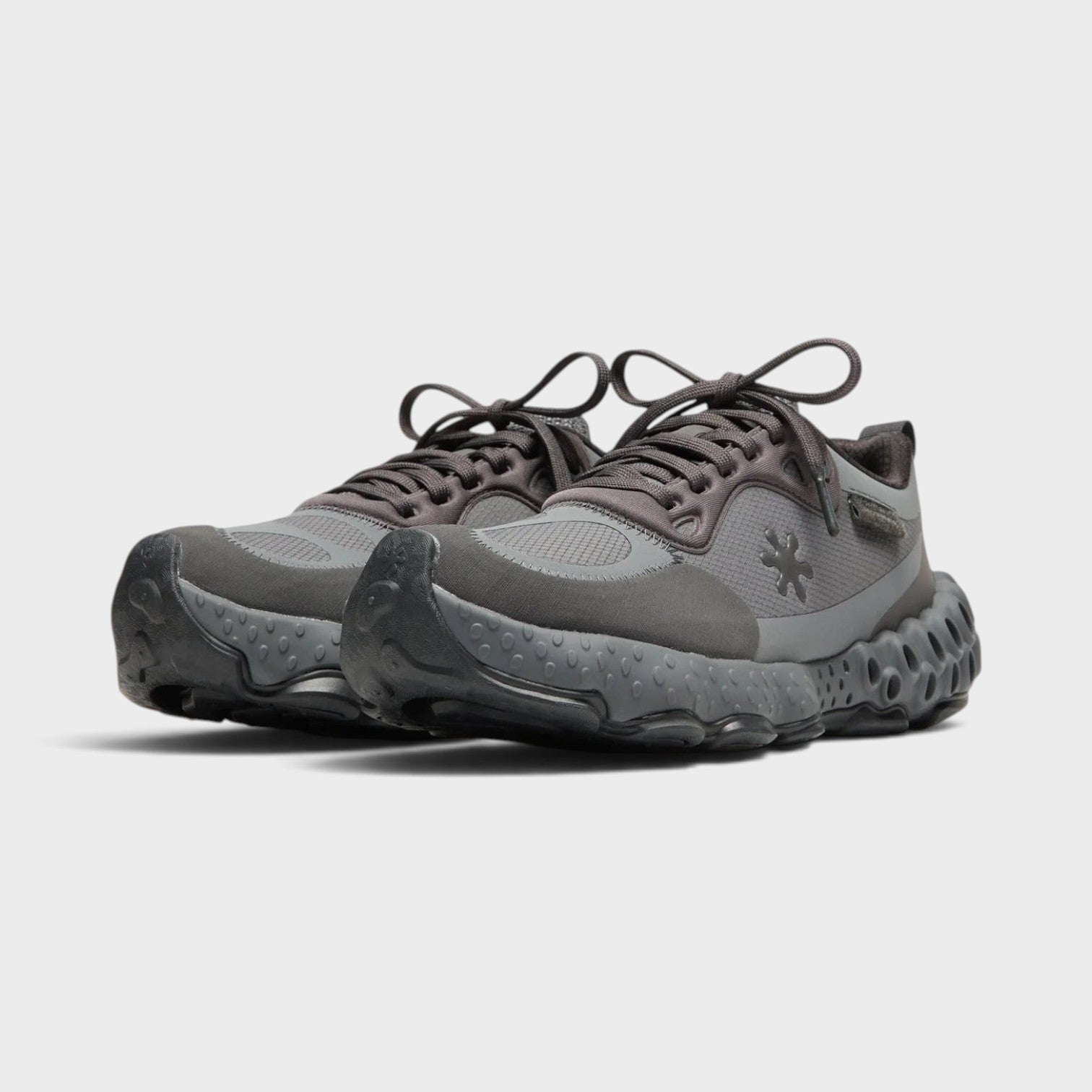 Supplied Fashion Salehe Bembury Osmosis sneakers in black and grey with a unique textured spunge midsole design.