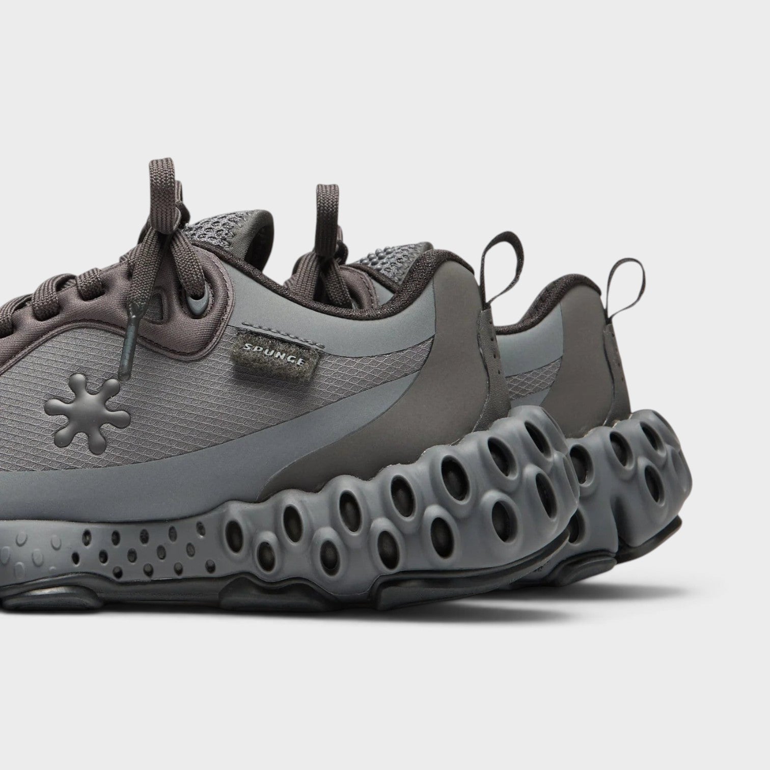 Supplied Fashion Salehe Bembury Osmosis sneakers in black and grey with signature spunge foam cushioning and mesh