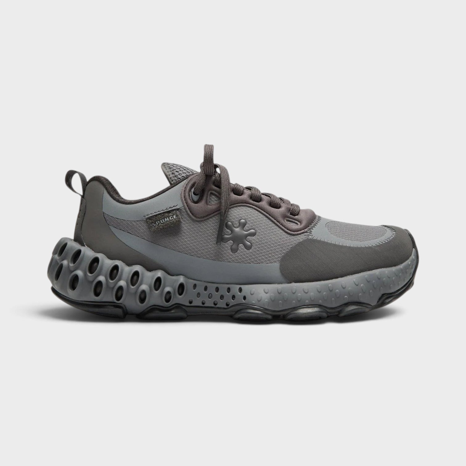 Supplied Fashion Salehe Bembury Osmosis sneaker in black and grey with a unique spunge foam midsole and mesh upper.
