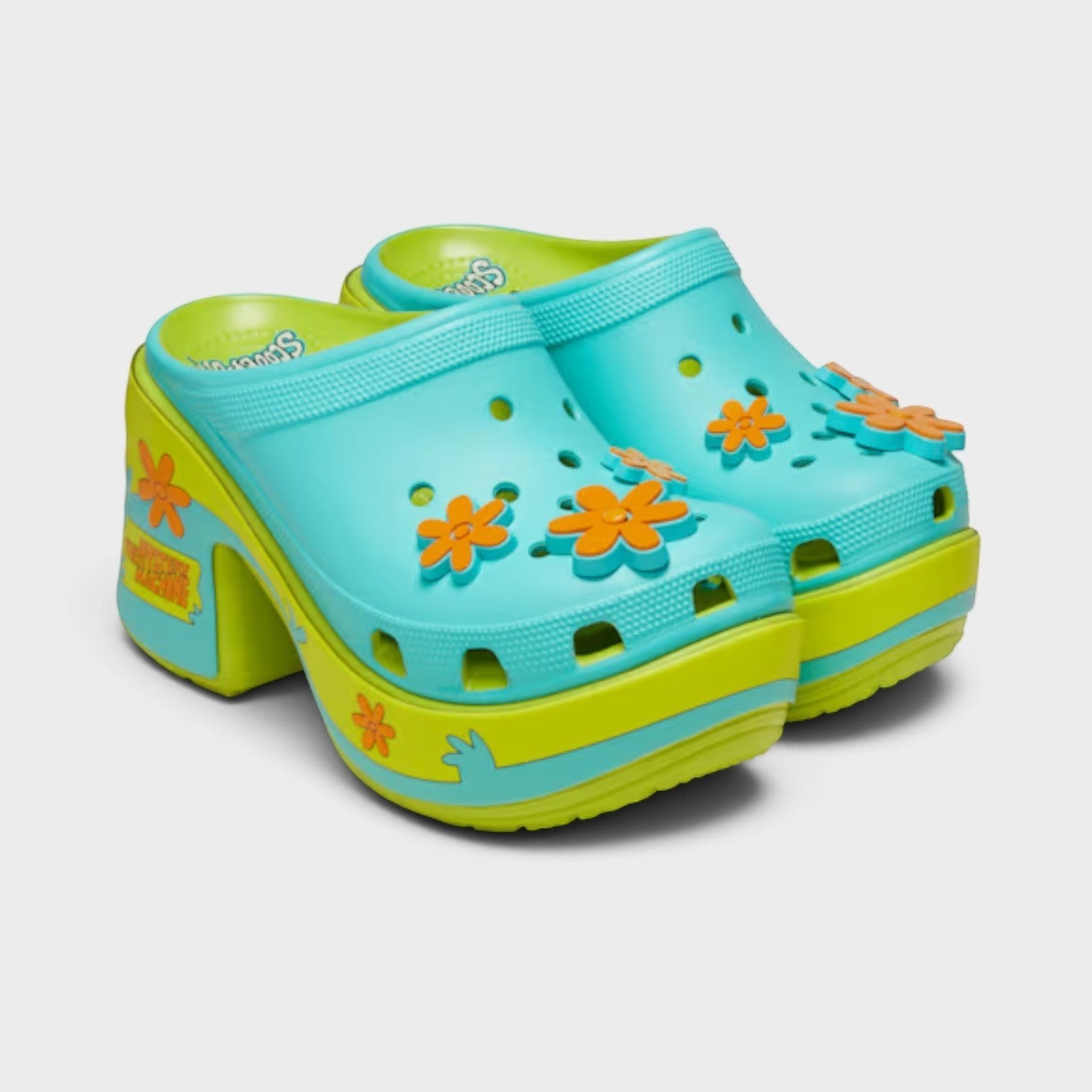 Supplied Fashion Scooby-Doo! Siren platform clogs in lime punch with orange flower charms and Mystery Machine graphics.