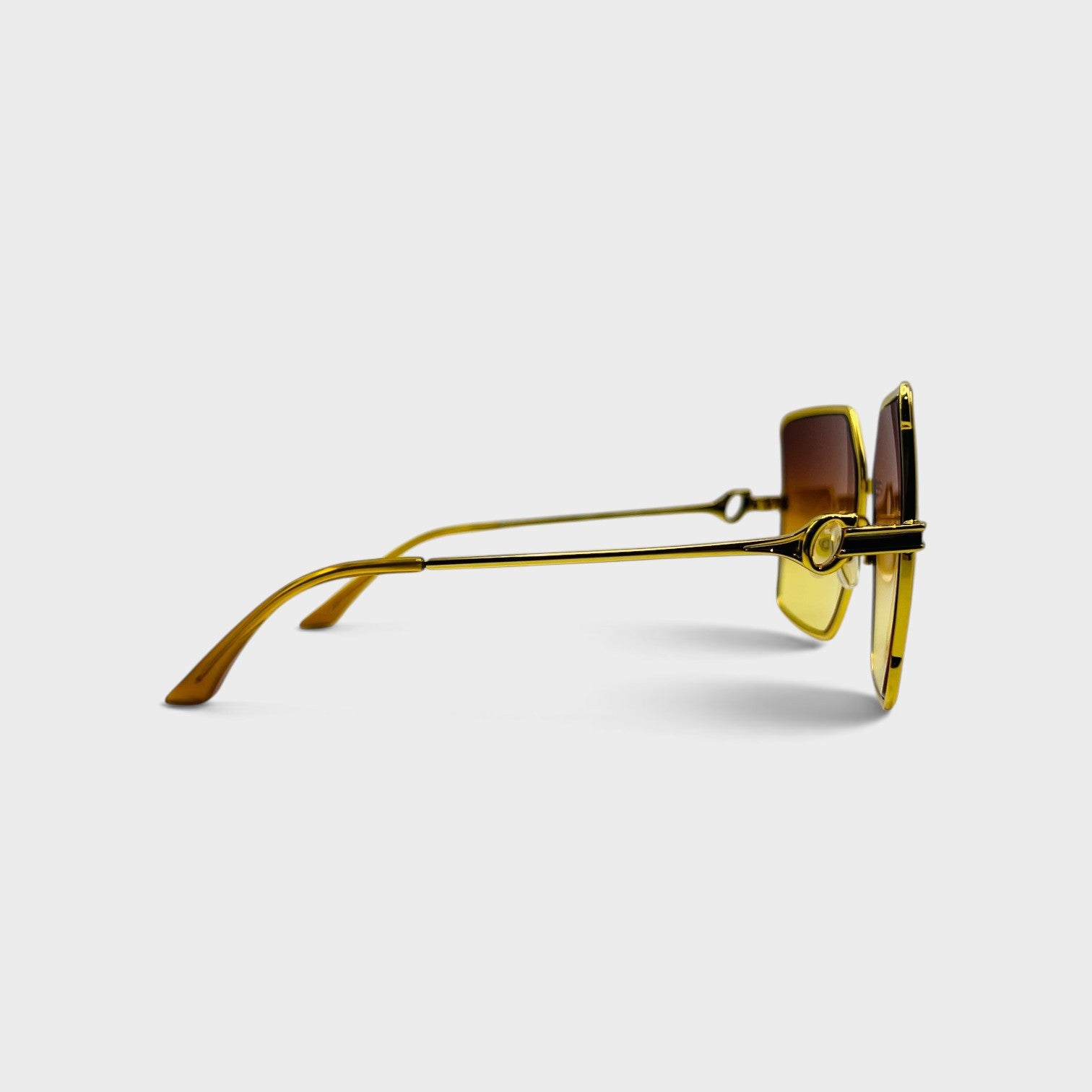 Supplied Fashion square stainless steel sunglasses with gold frames and orange sunset gradient lenses, side view.