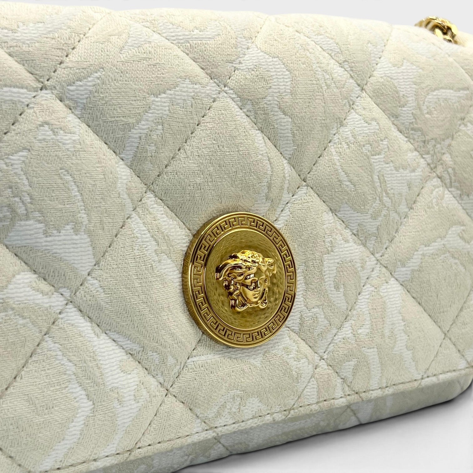 Supplied Fashion Versace Medusa Head shoulder bag in beige with quilted fabric and gold-tone hardware detail