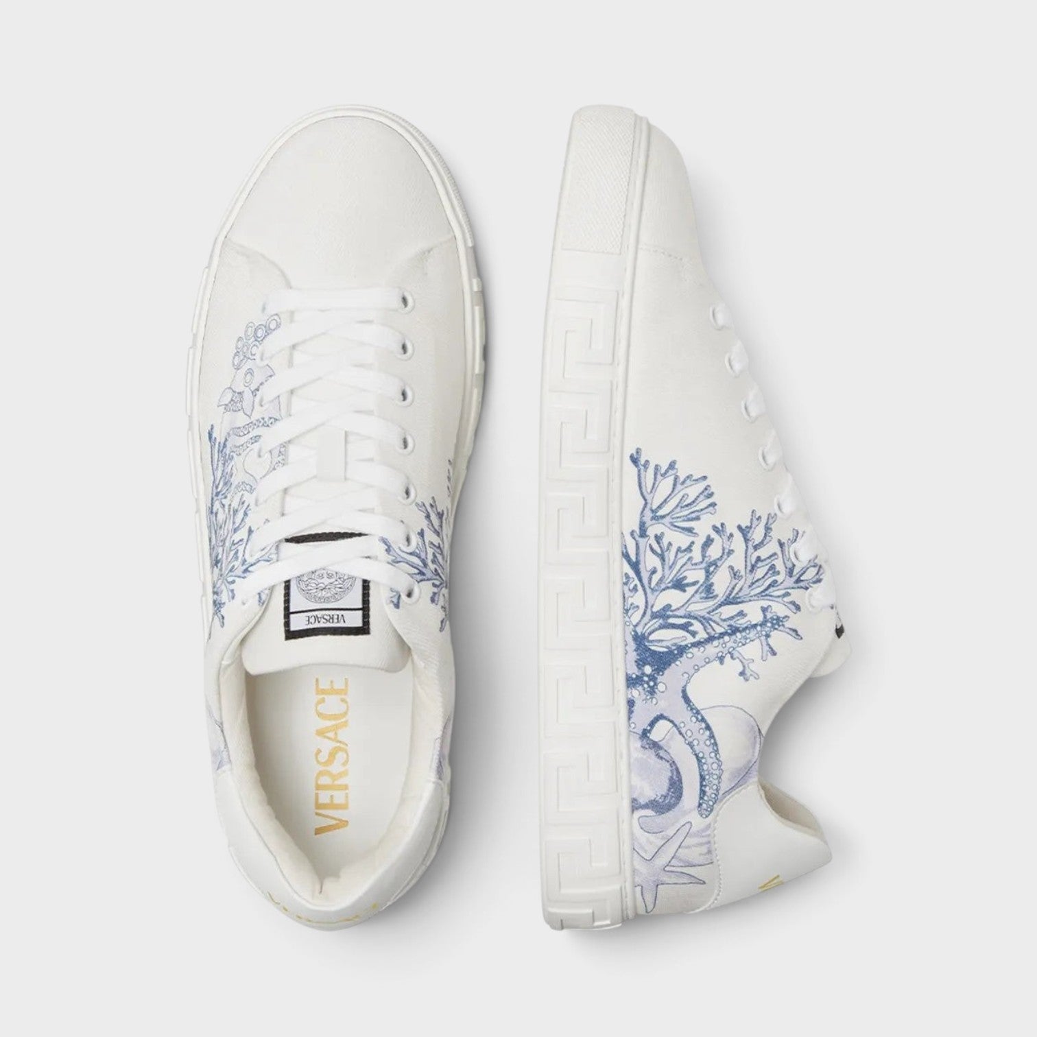 Supplied Fashion Versace Coral Theatre Greca sneakers in white with blue marine-themed print and signature side motif.