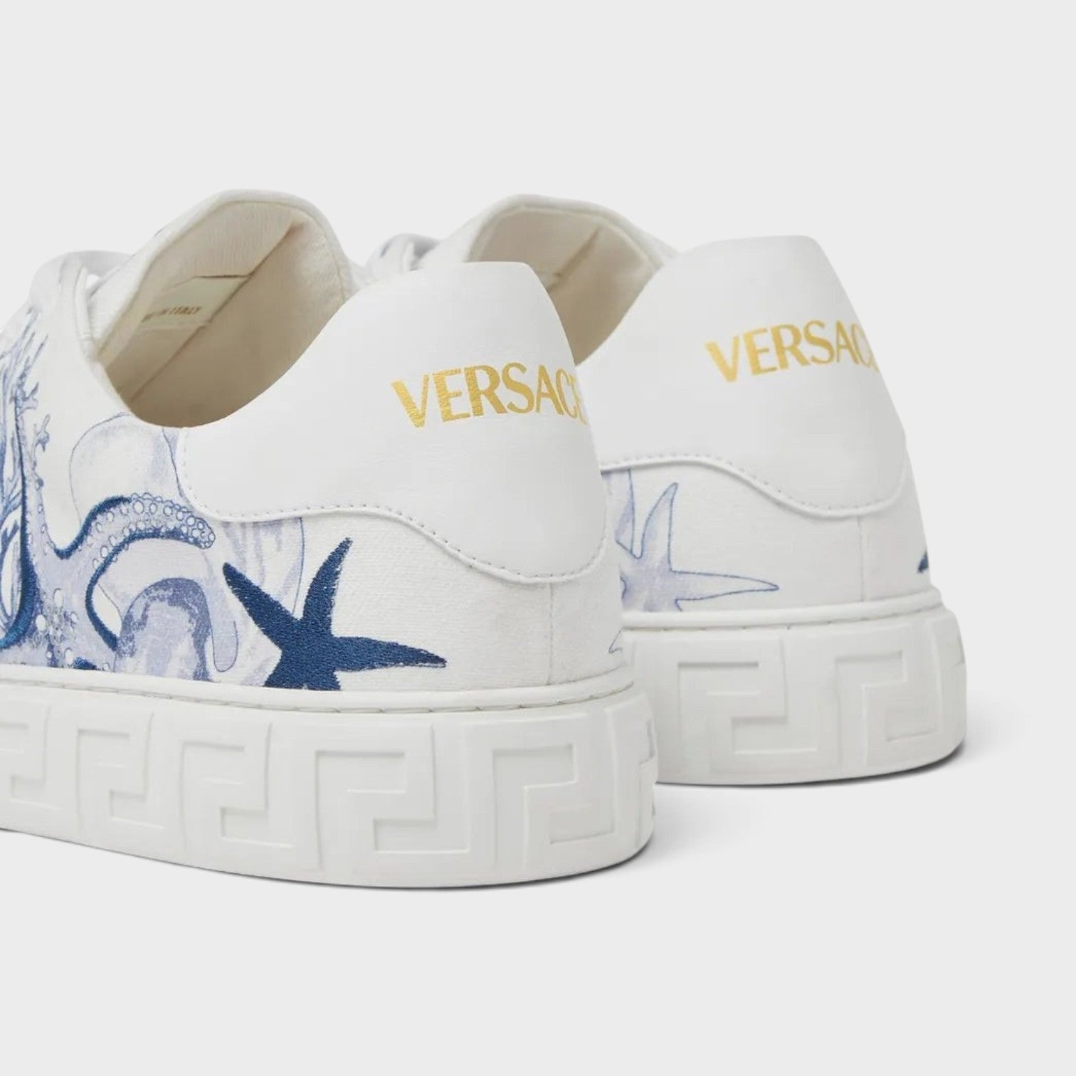 Supplied Fashion Versace Coral Theatre Greca sneakers in white with blue octopus and starfish print and gold logo