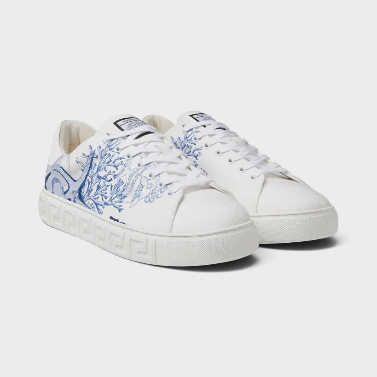Supplied Fashion Versace Coral Theatre Greca sneakers in white canvas with blue coral print and embossed side soles.