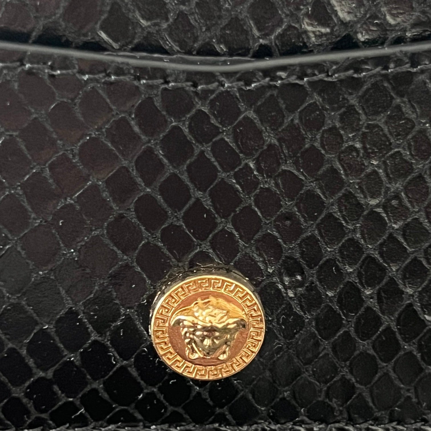 Supplied Fashion Versace Medusa Head cardholder in black snakeskin-embossed leather with a gold-tone logo stud.