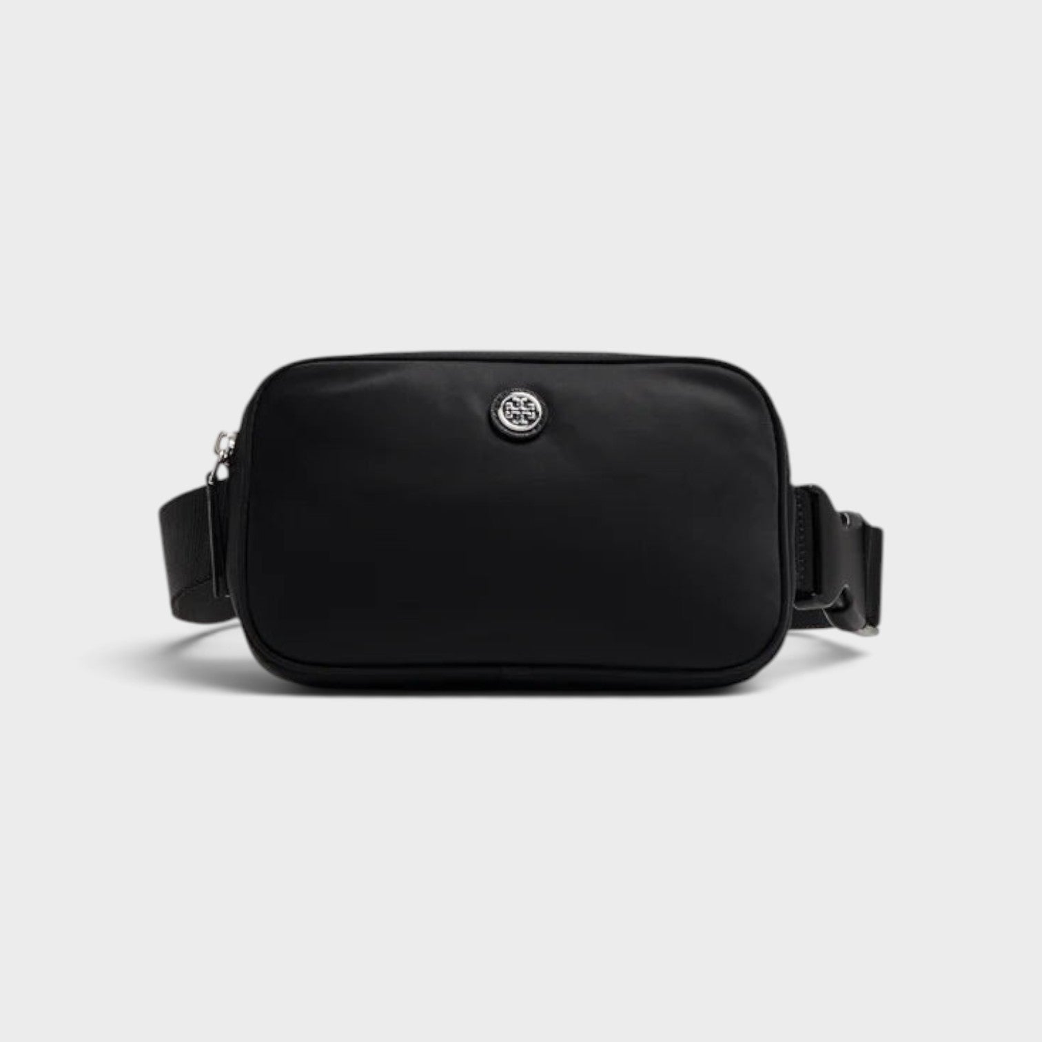 Supplied Fashion Virginia black nylon belt bag with silver logo hardware, worn as a versatile crossbody fanny pack.