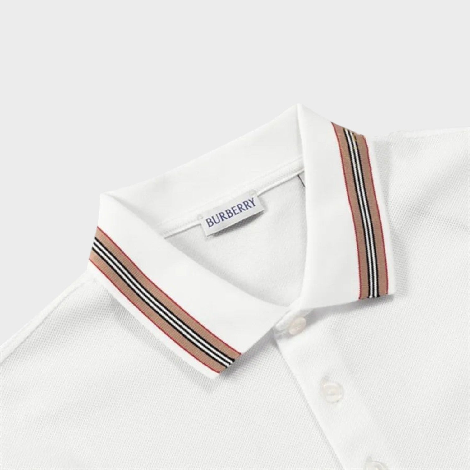 Supplied Fashion white long-sleeve polo shirt featuring a classic Burberry check stripe collar and button placket.