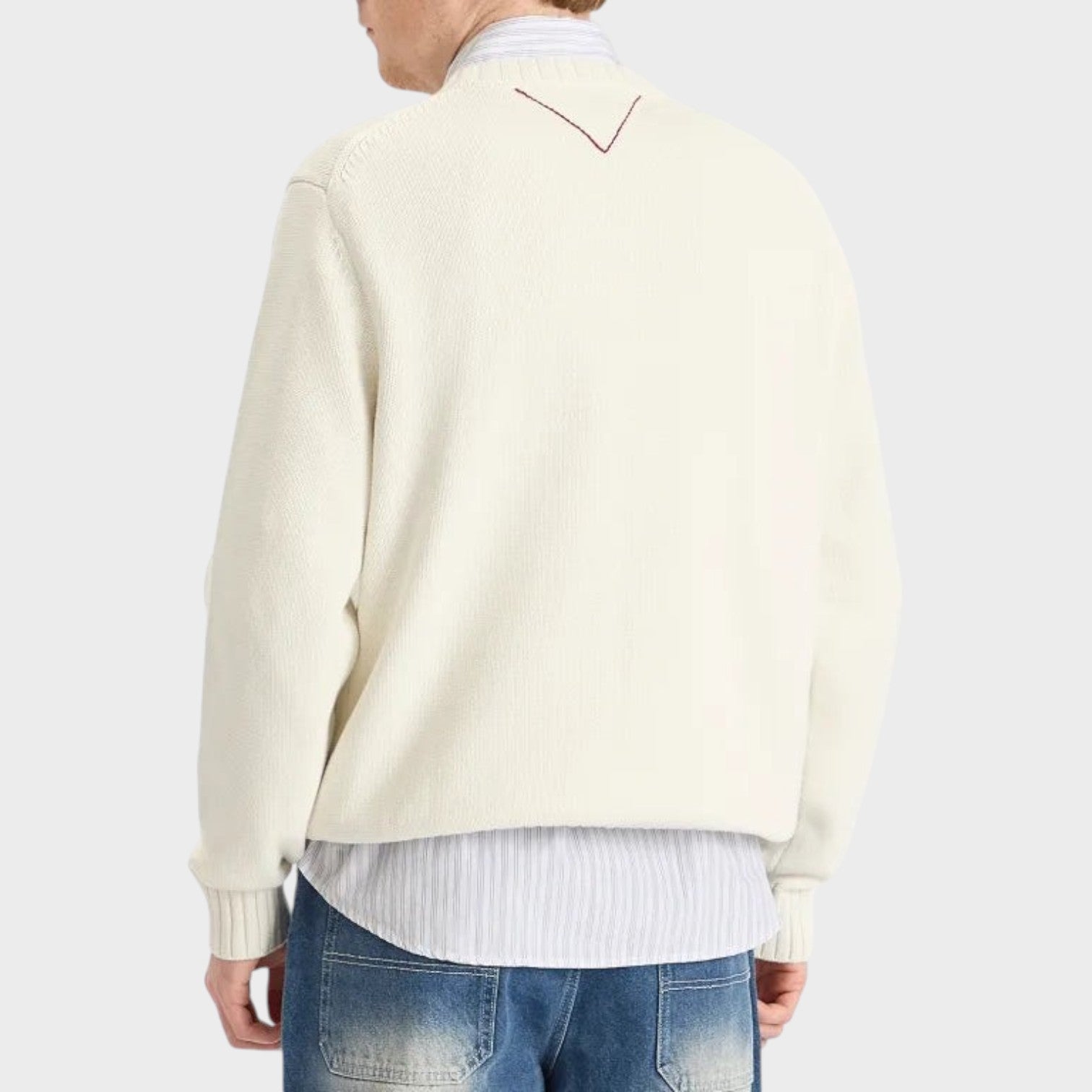Back view of Supplied Fashion white crewneck knit sweater with subtle red V-stitch detail on the collar