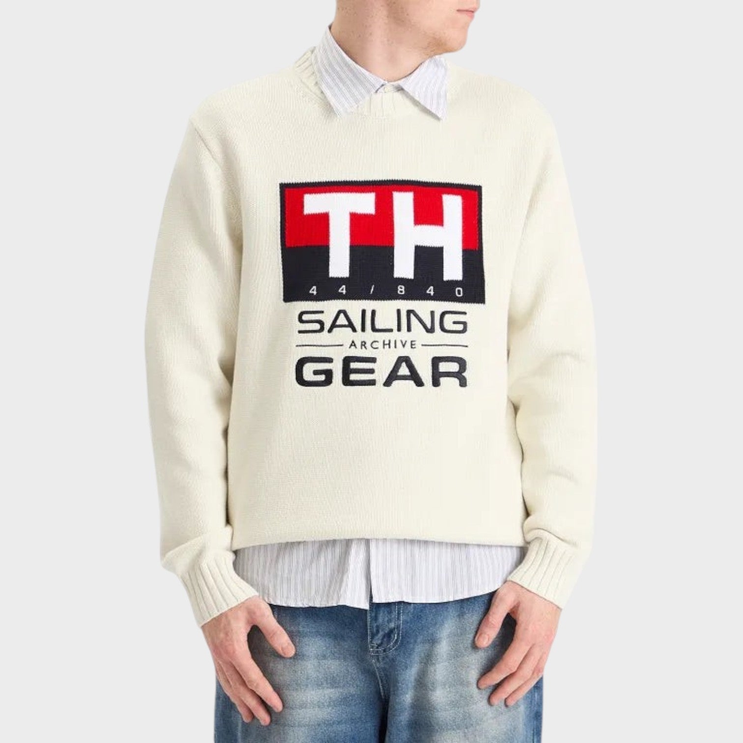 Supplied Fashion white Tommy Hilfiger Gi Sailing crewneck knit sweater with graphic logo worn over a striped shirt